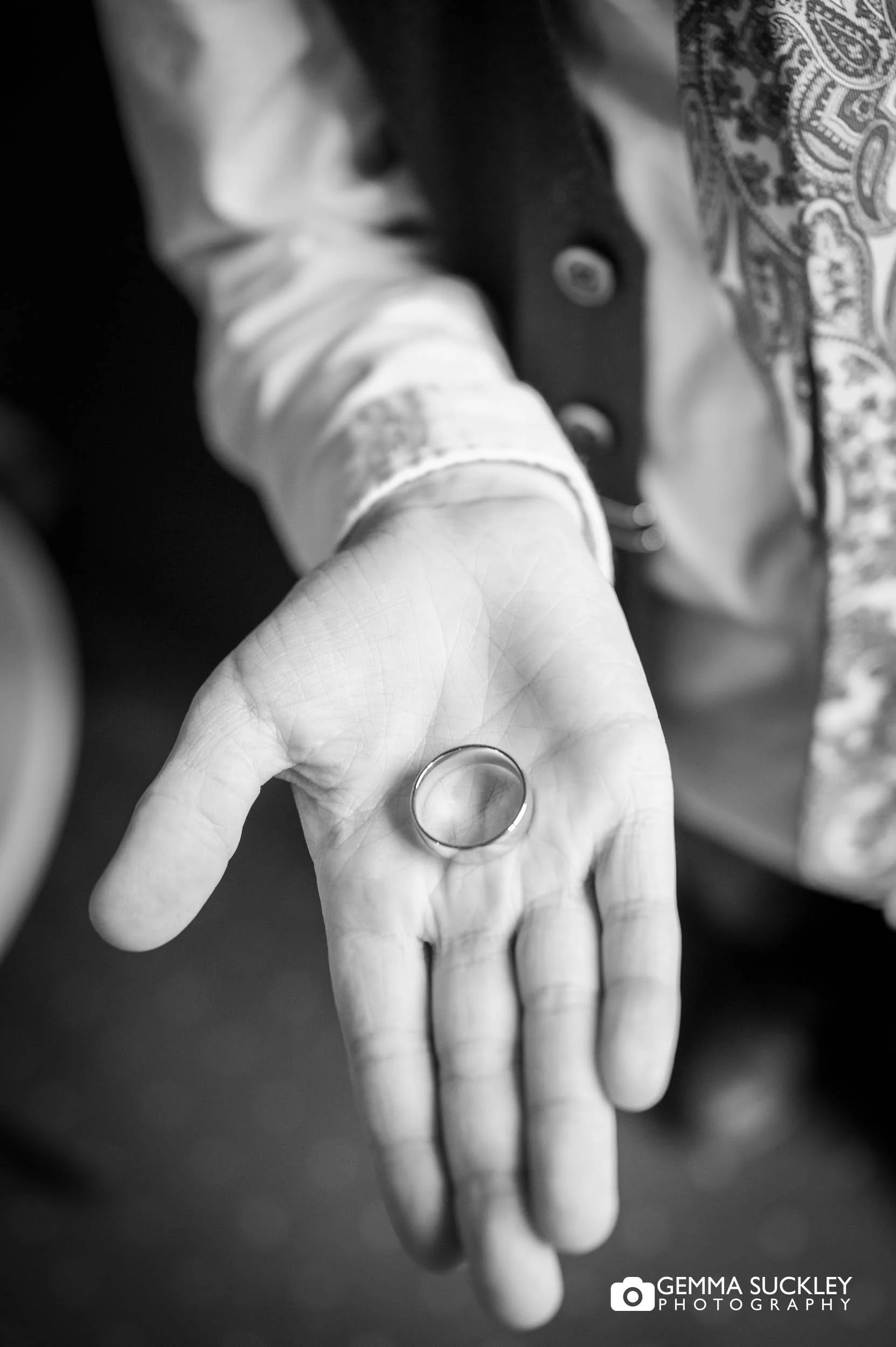 wedding ring in the page boy's hand