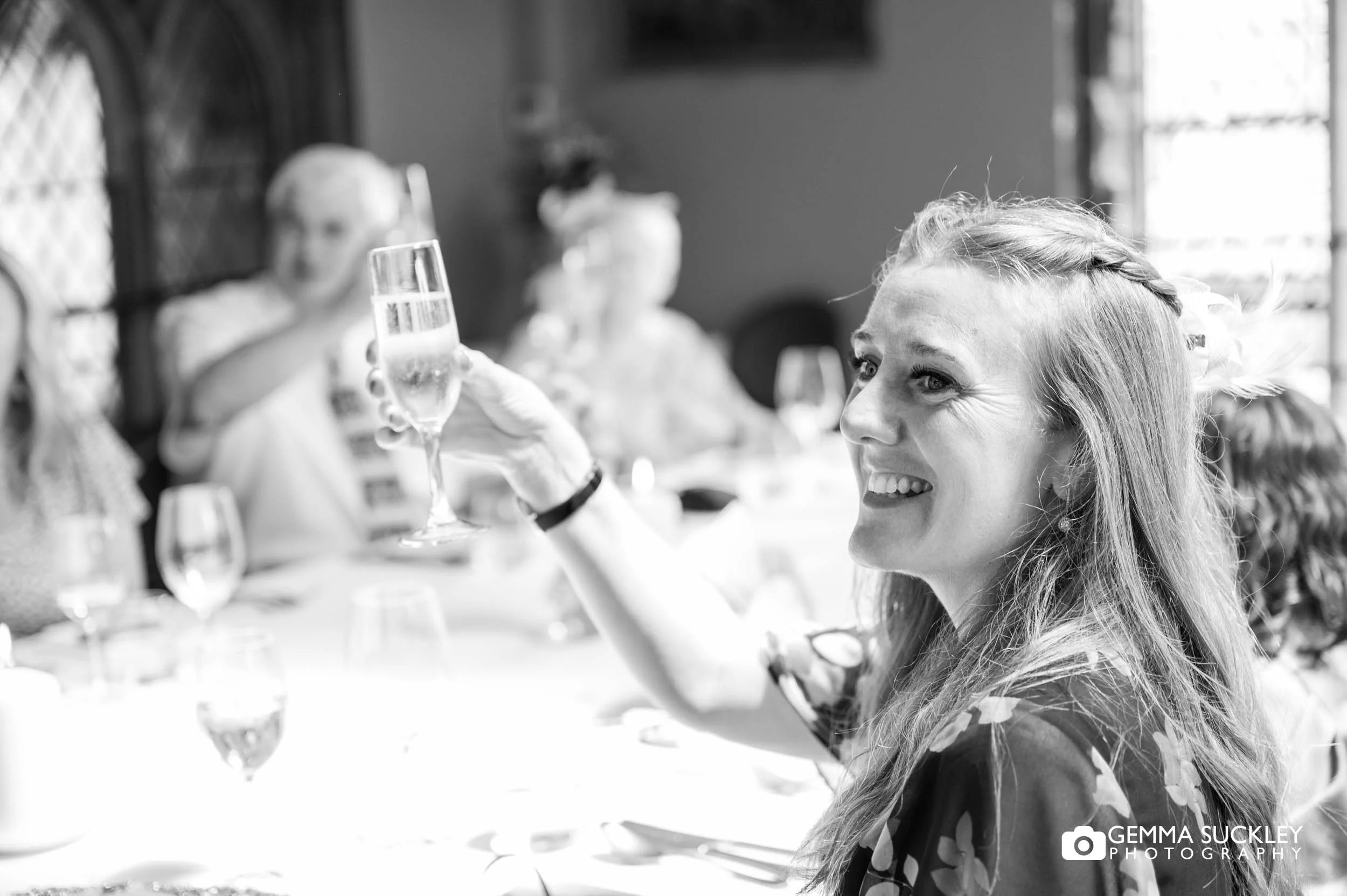 wedding guests toasting at york minster refectory