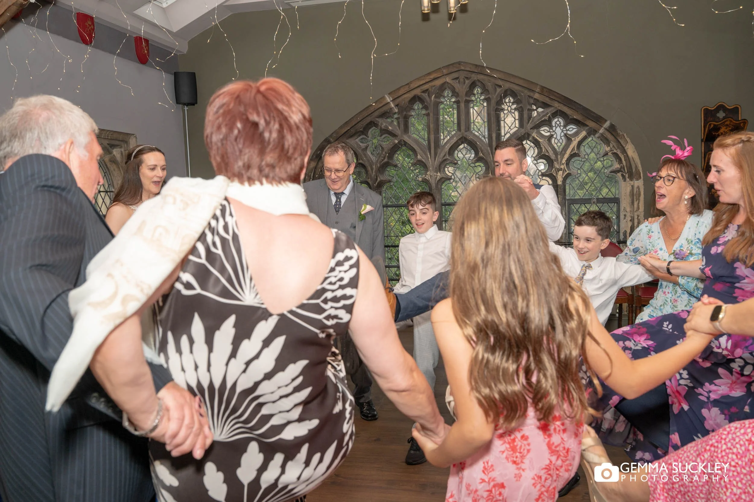 wedding guests dancing at york minster refectory
