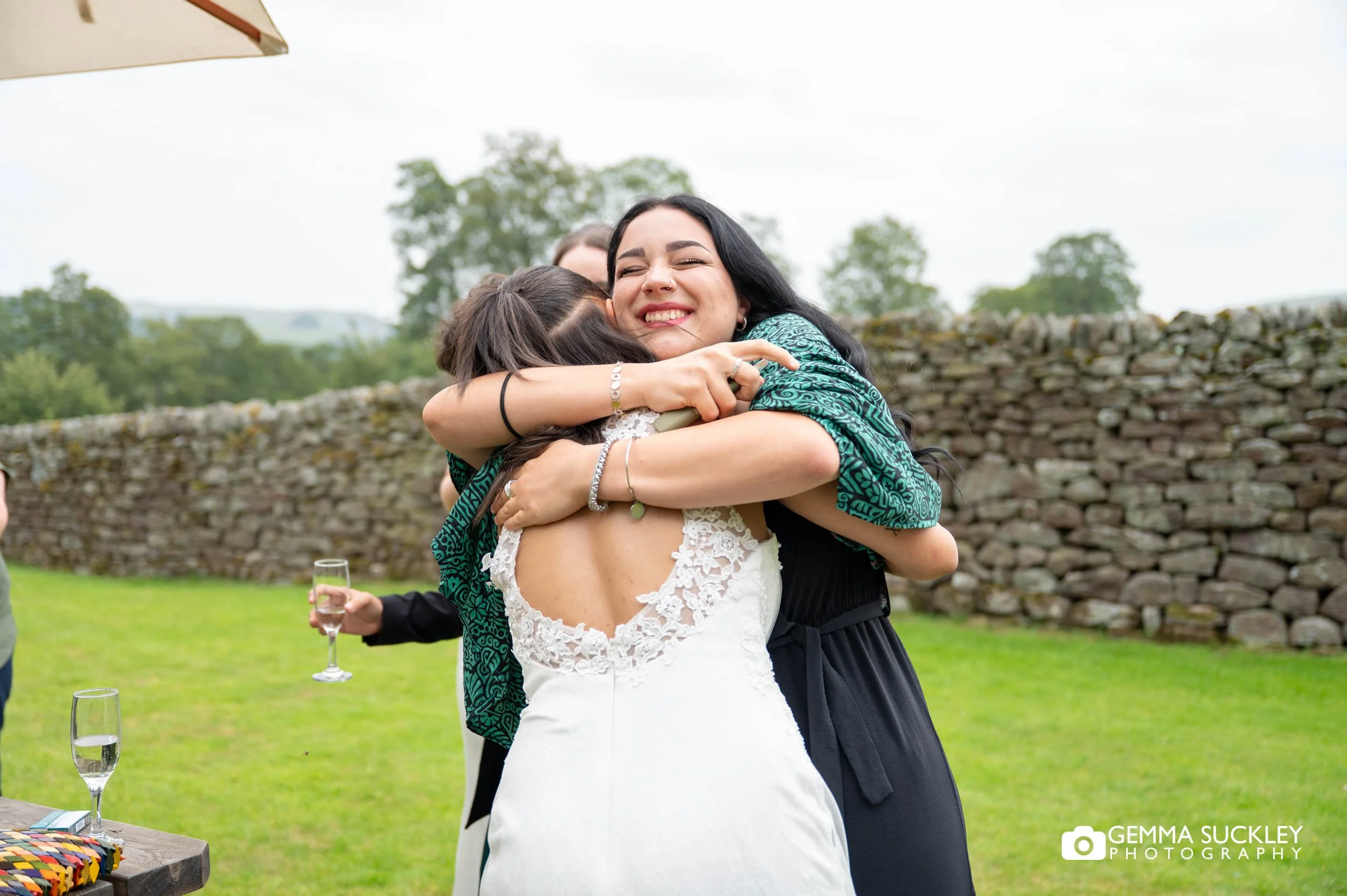 newly-weds greet their guests at the priests house