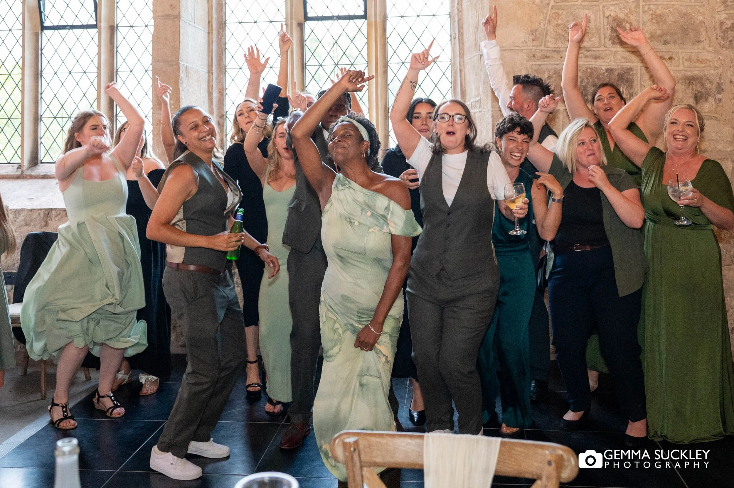 wedding guests dancing at the priests house