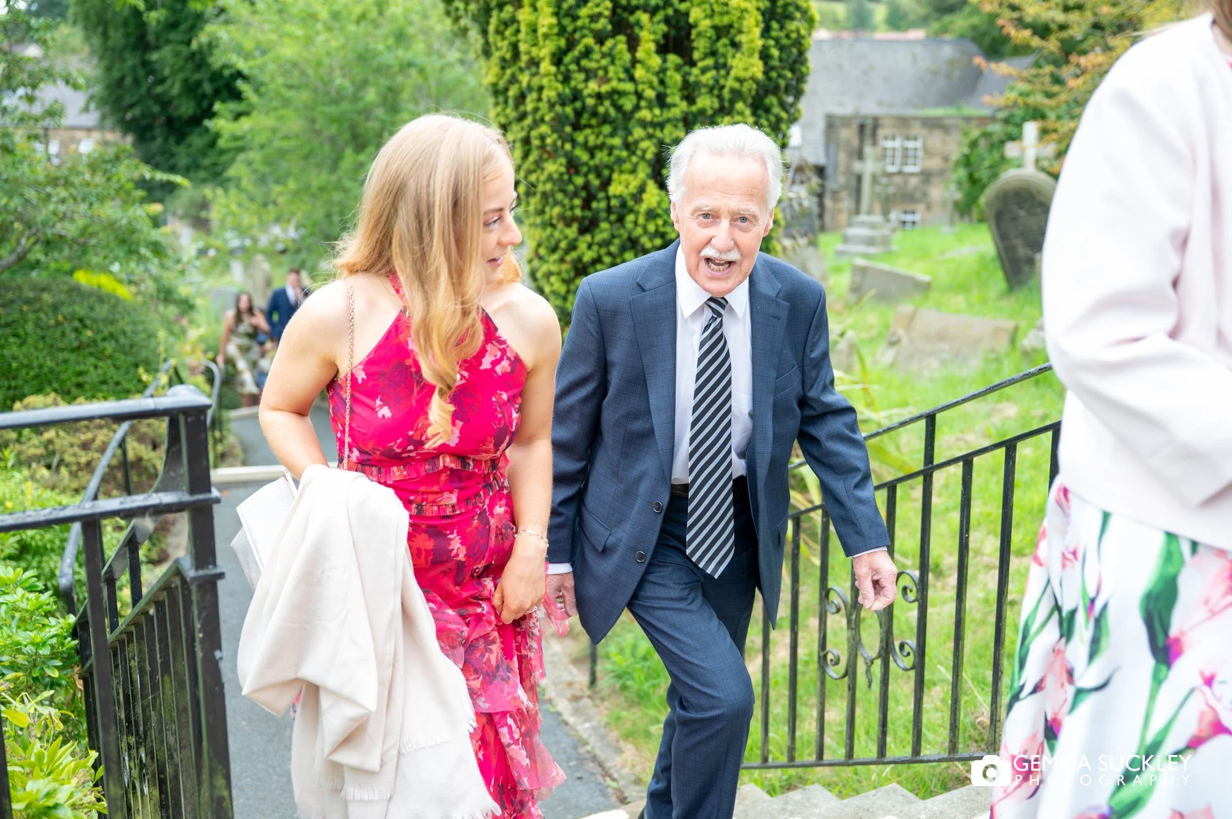 wedding guests arriving at church