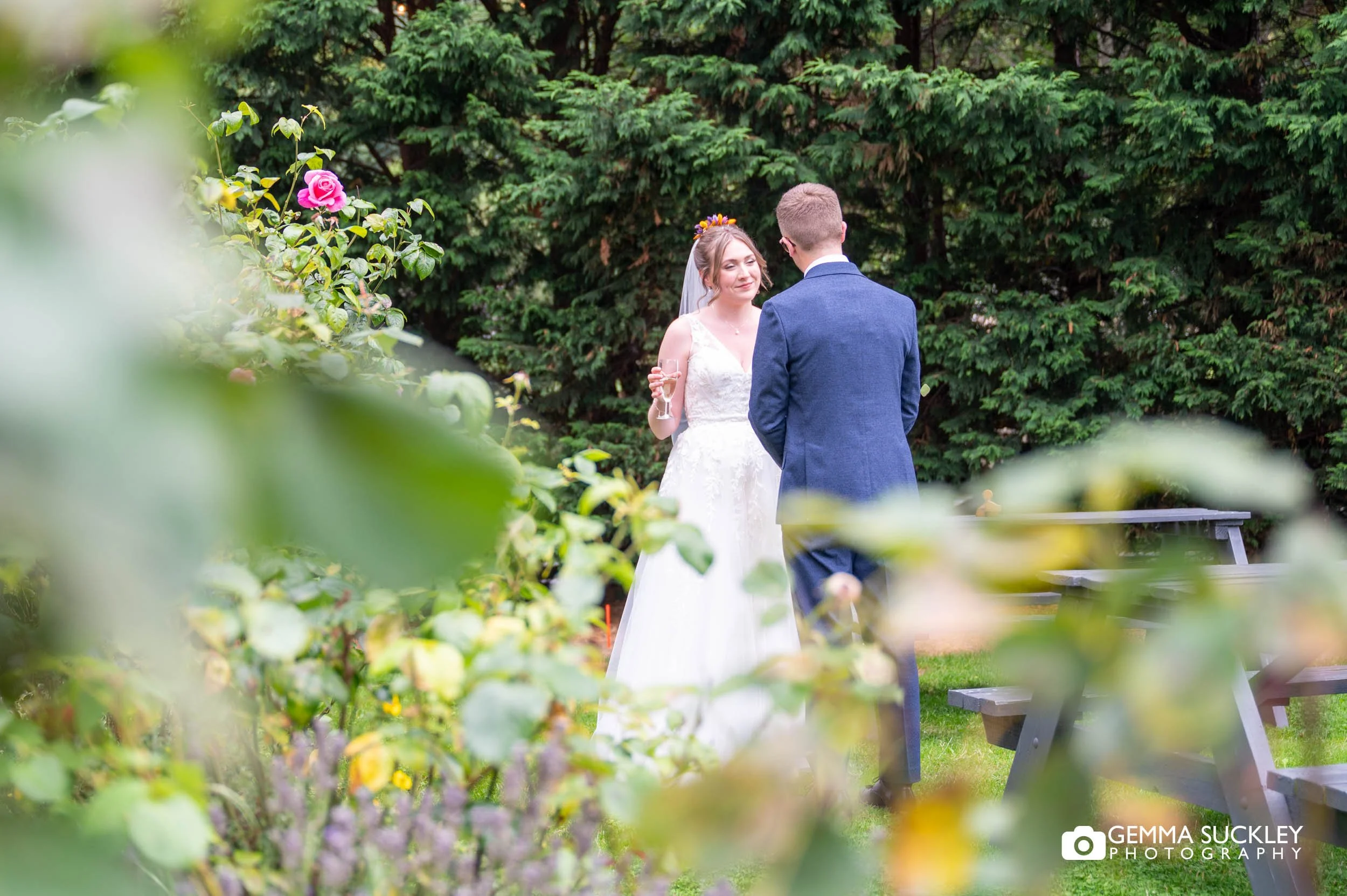 bride and groom in the garden at the old barn in esholt