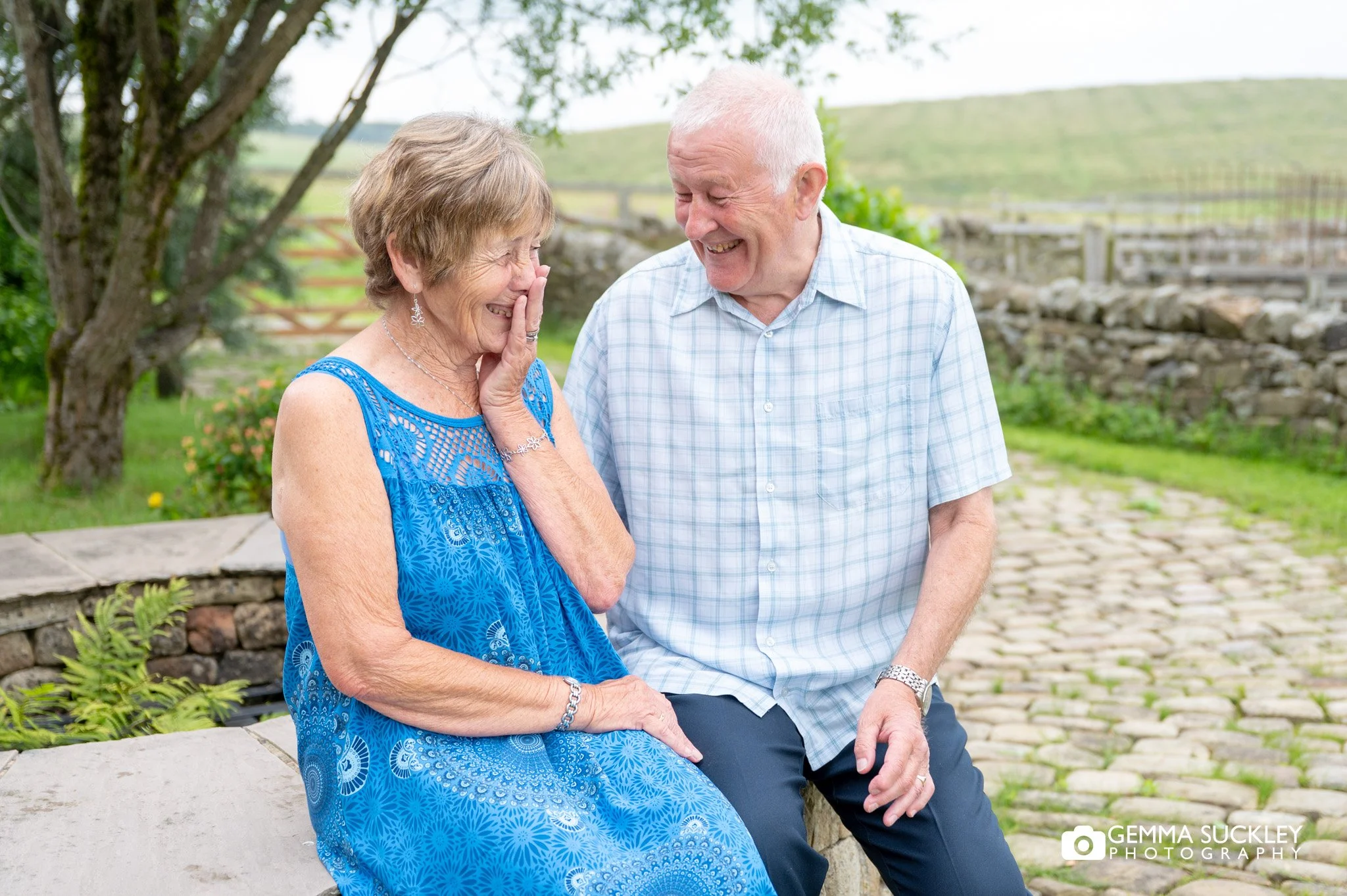 elderly couple giggling together