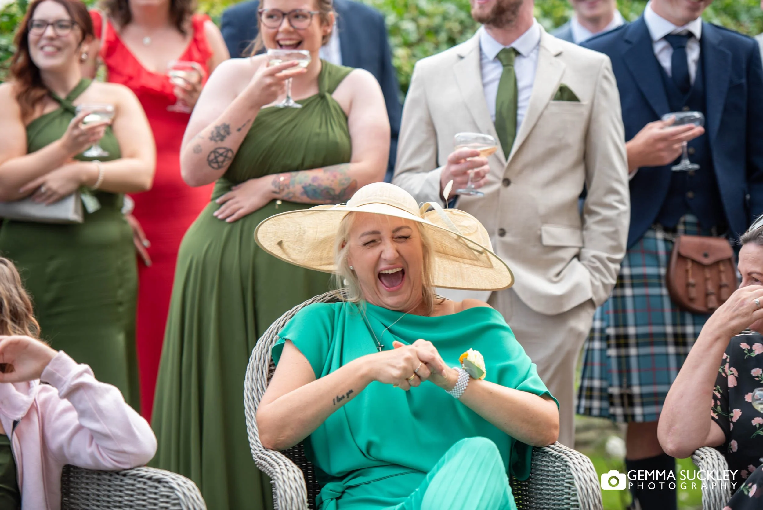 wedding guest laughing at speeches