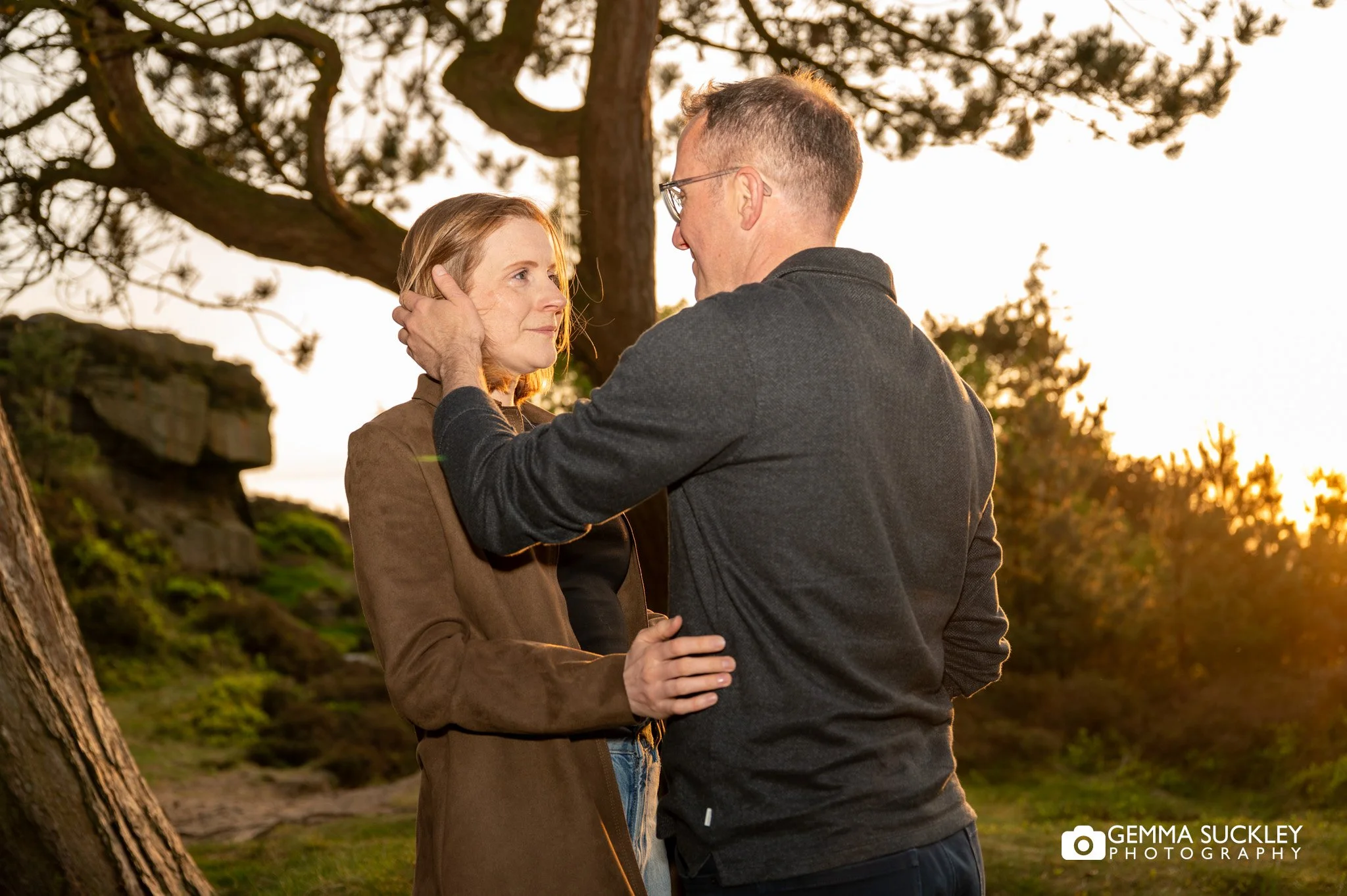engaged couple at golden hour on ilkley moor