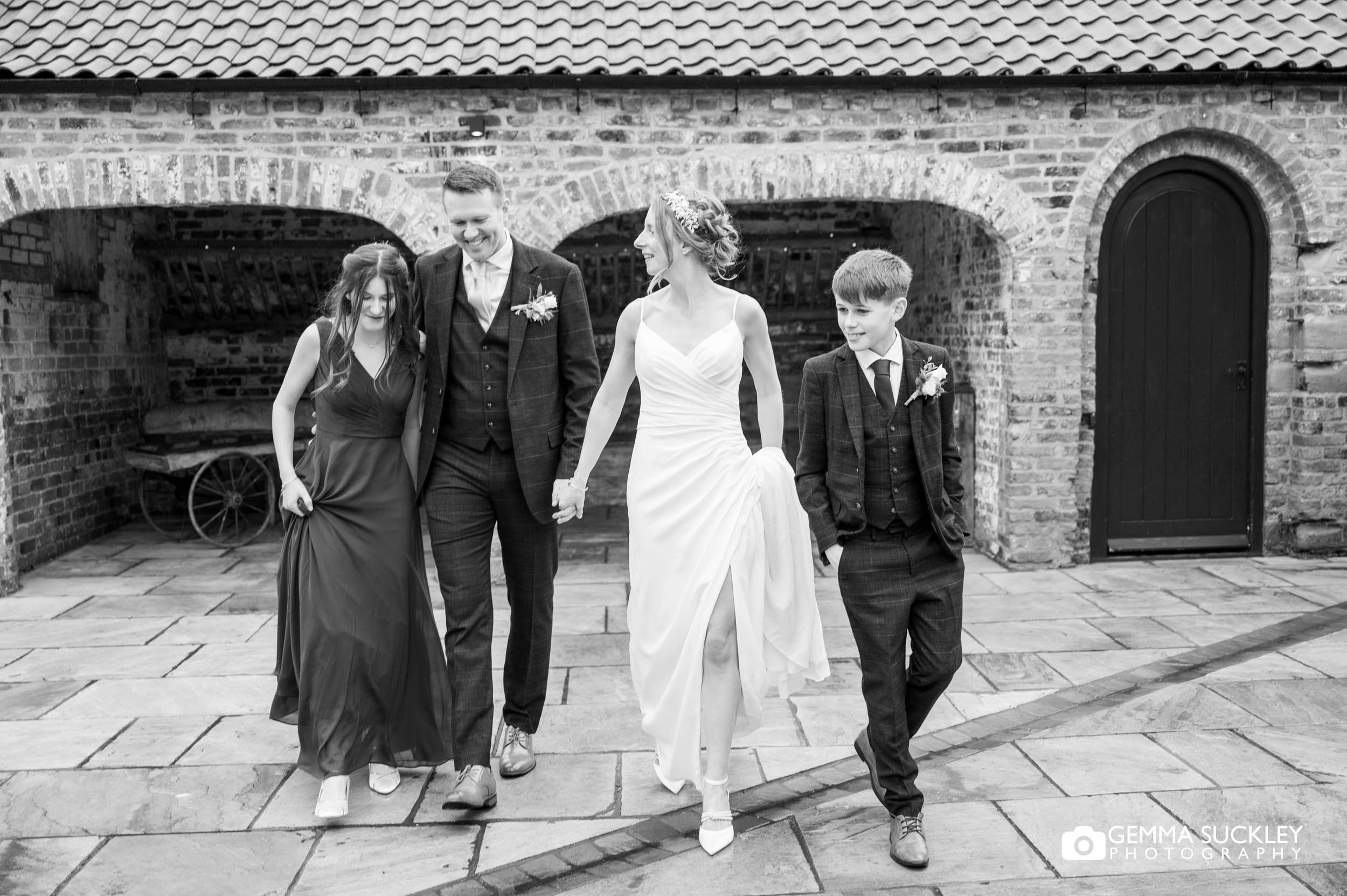 just married couple and the kids at thrisk lodge barn