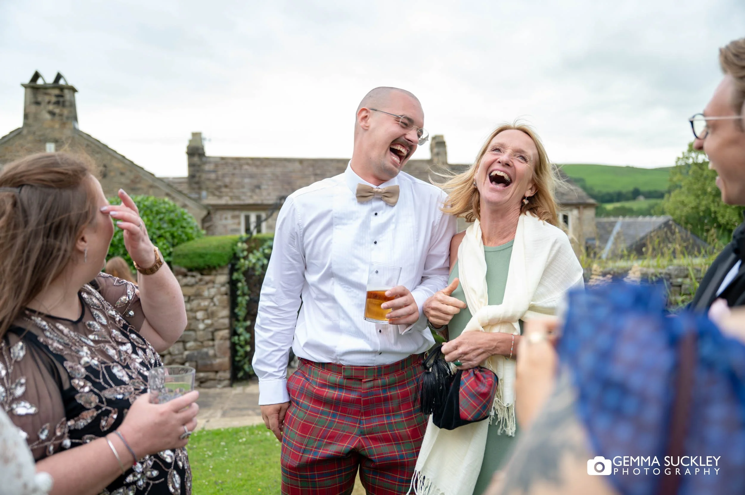 wedding guests laughing