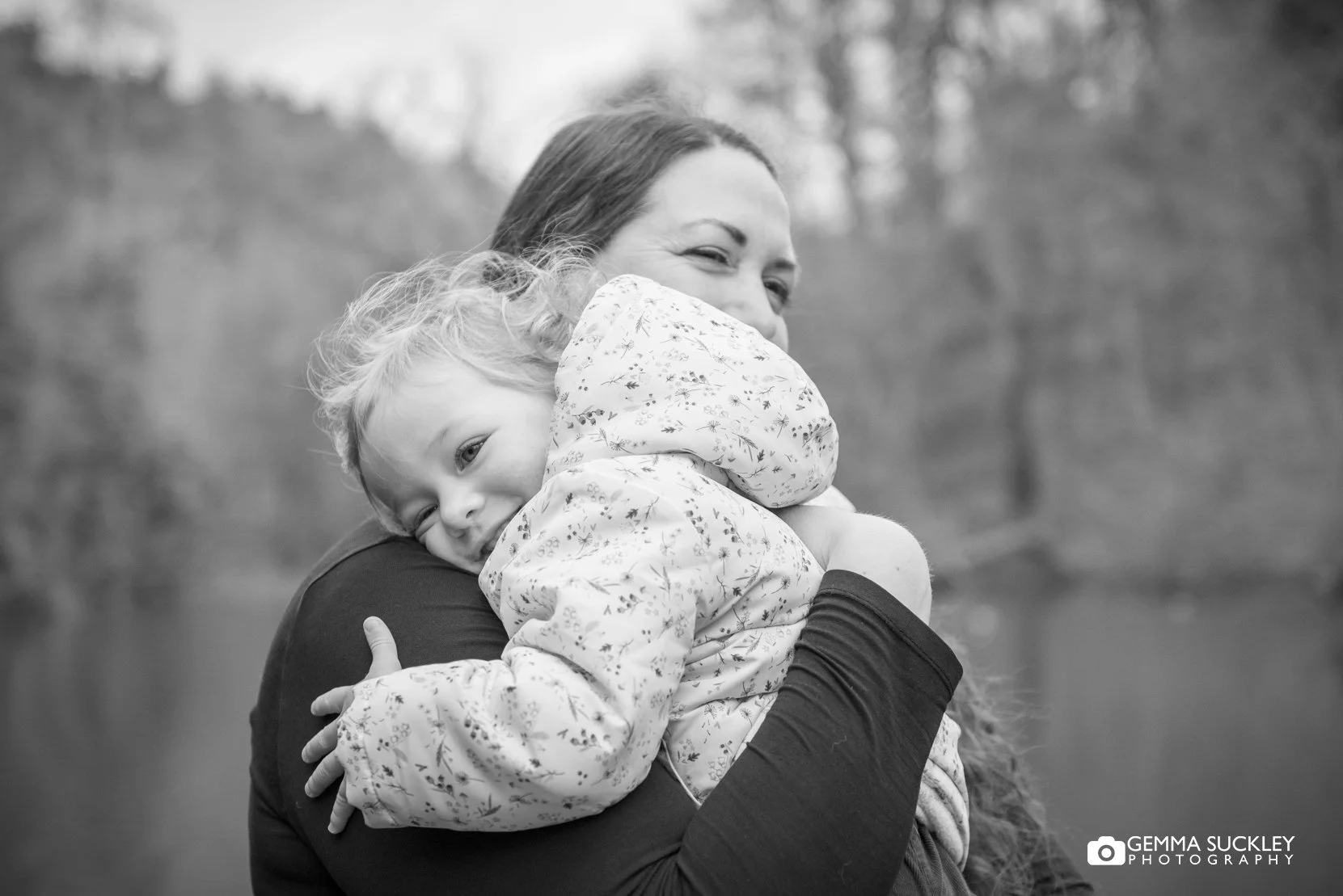 mum and little girl hugging in skipton woods