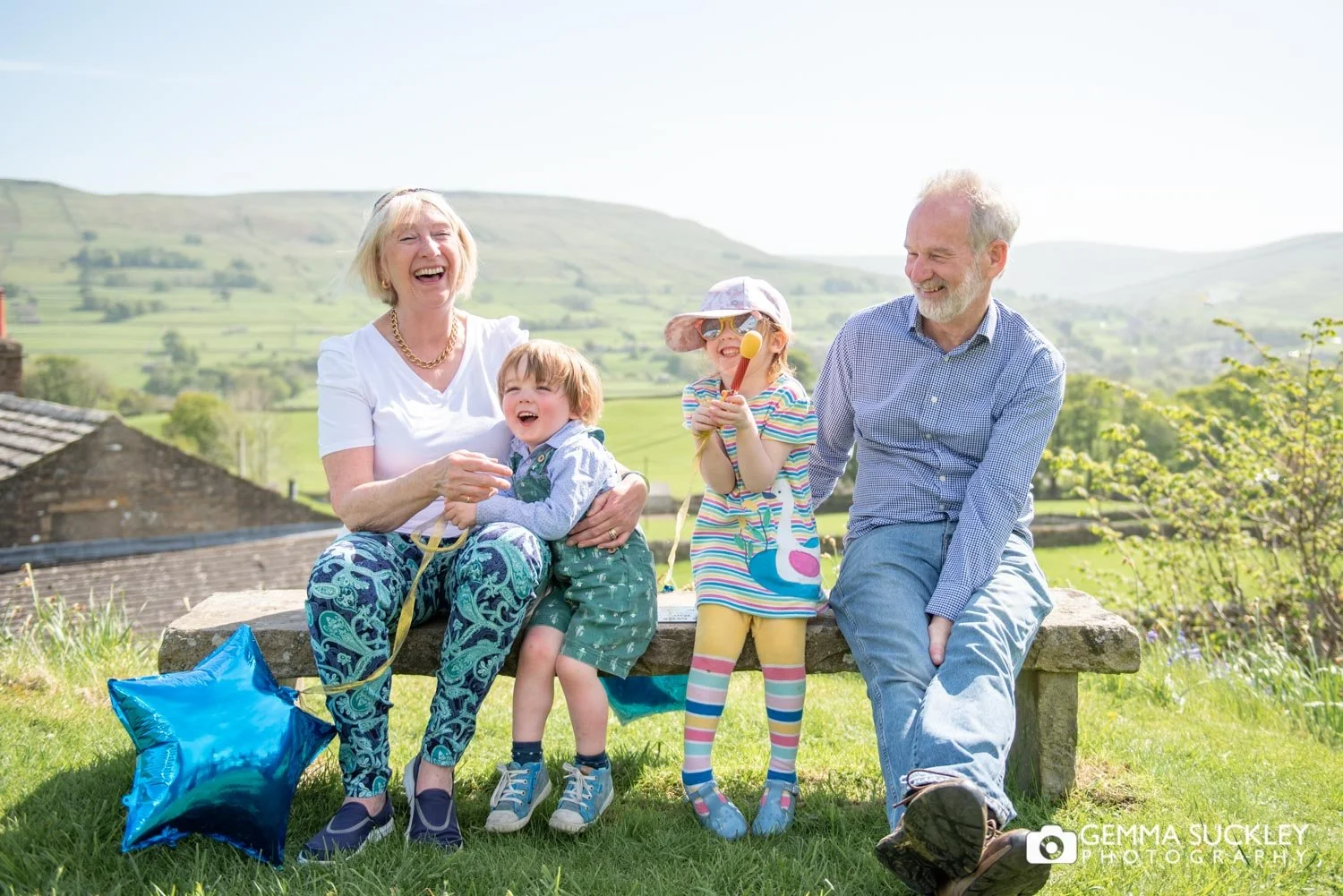 grandparents and grandchildren laughing together