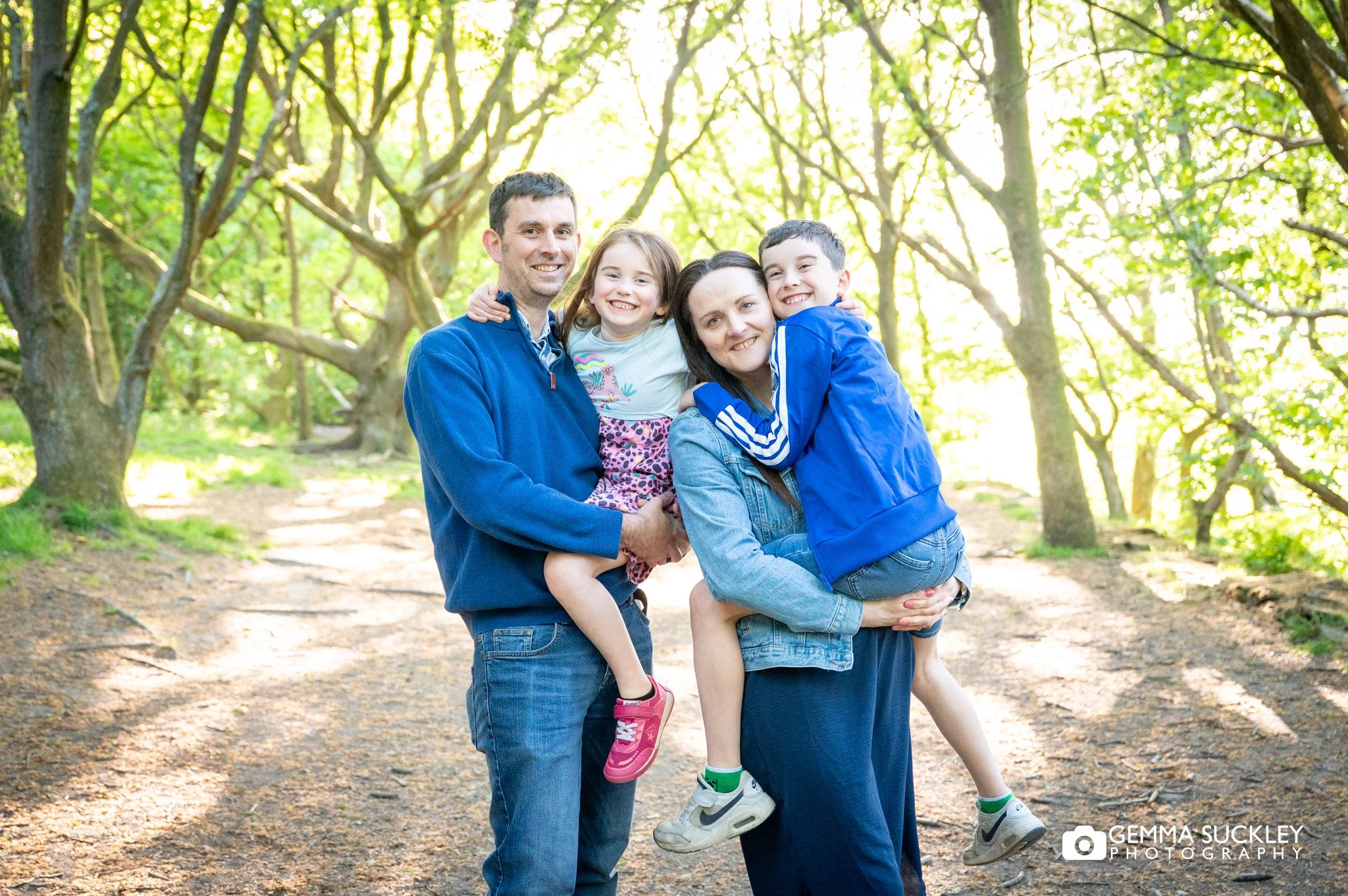 a family smiling at otley chevin 