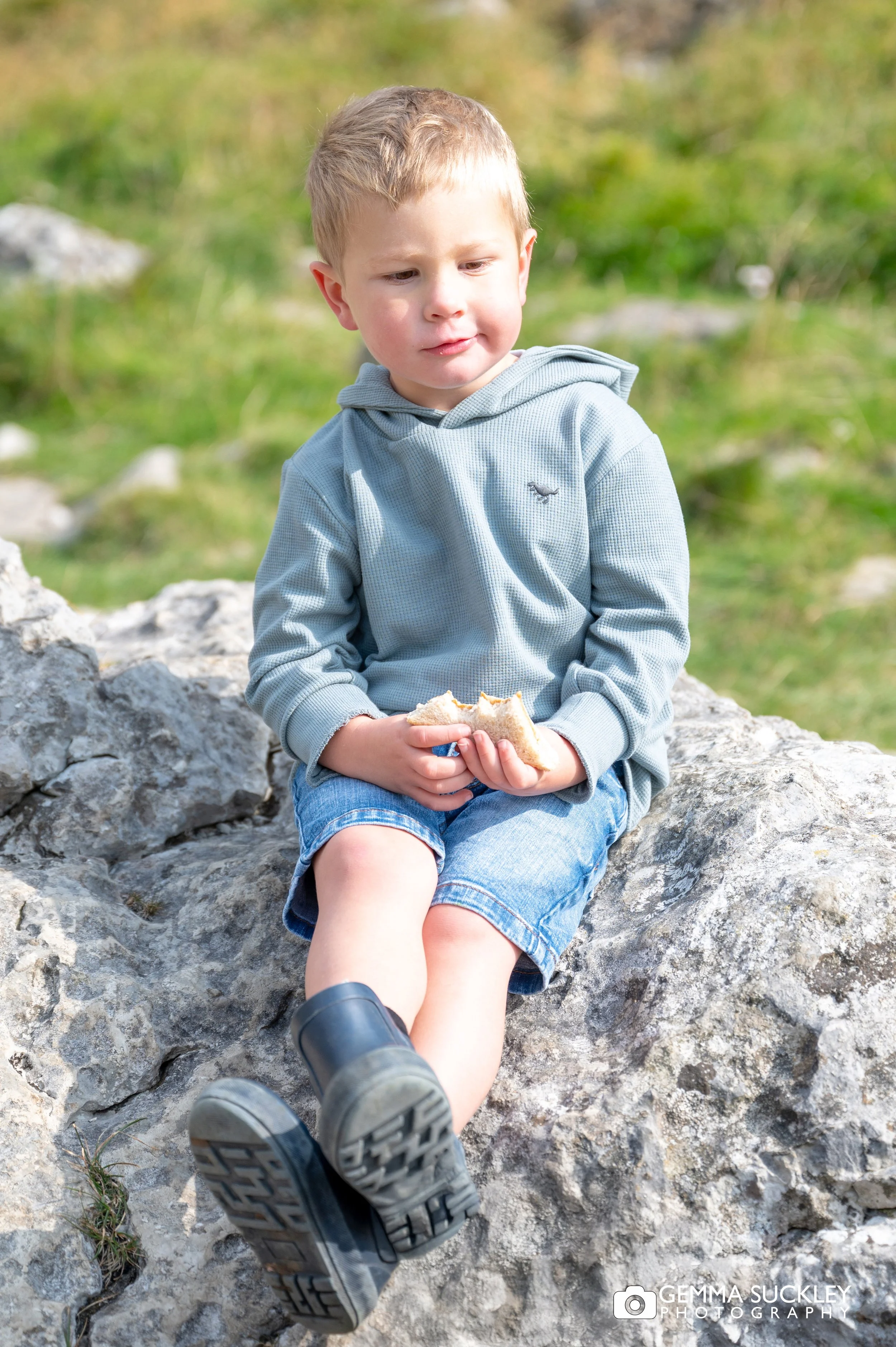 little boy eat his sandwich at malham cove