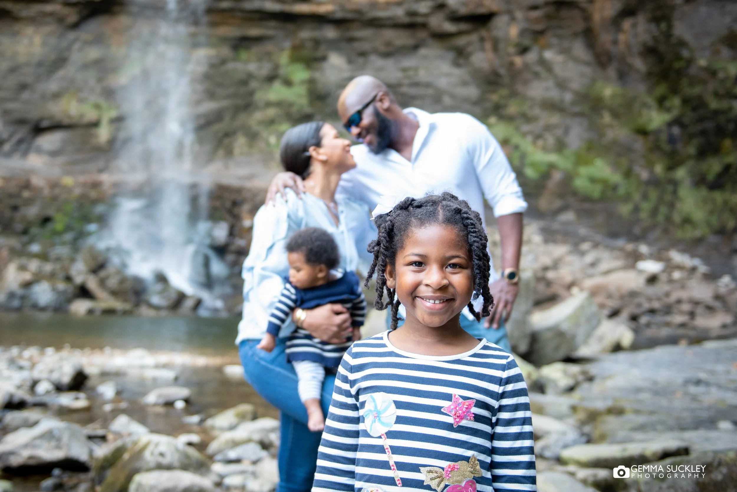 little girl in front of her family at hardraw force