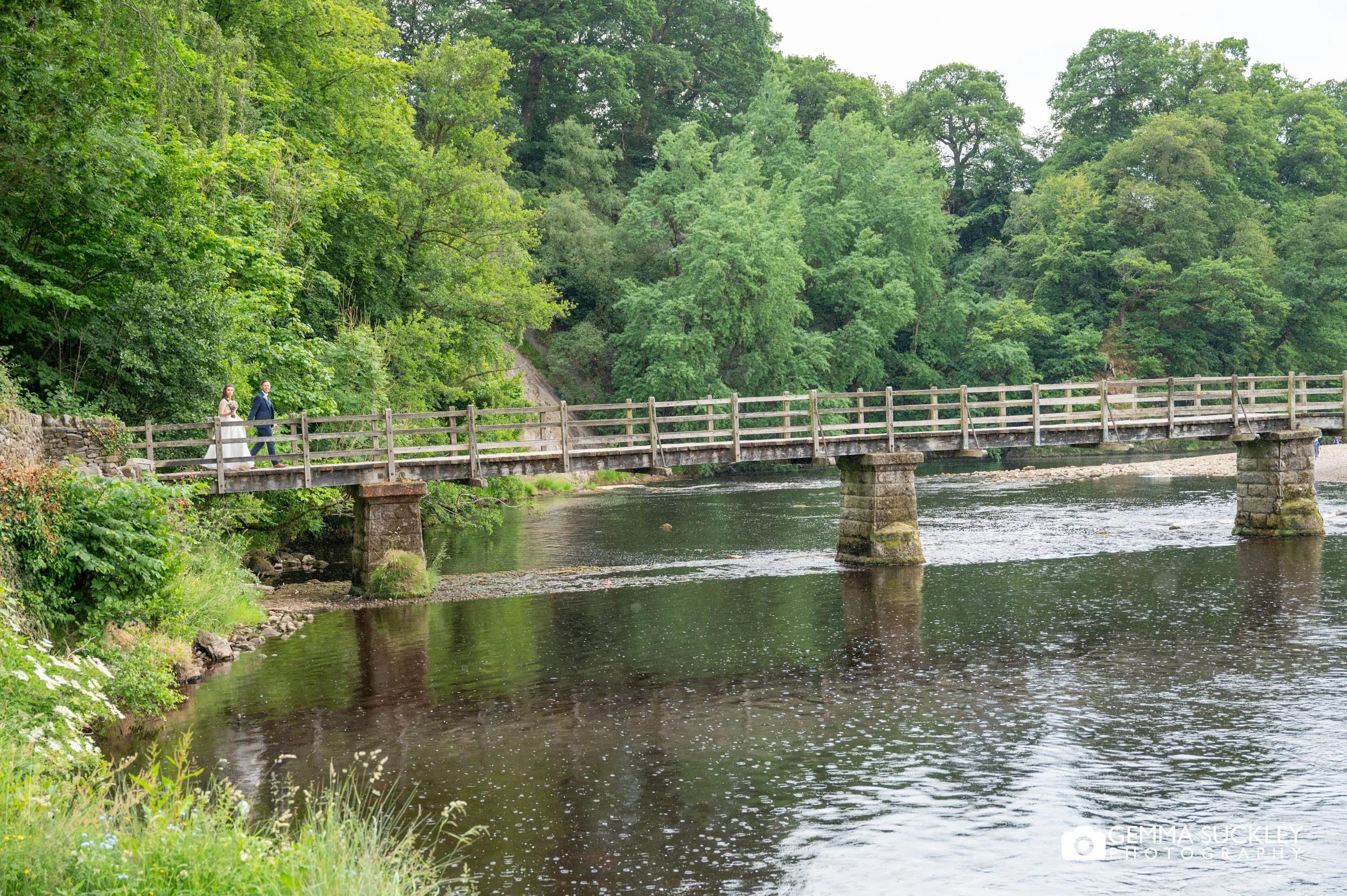 just married couple at bolton abbey river