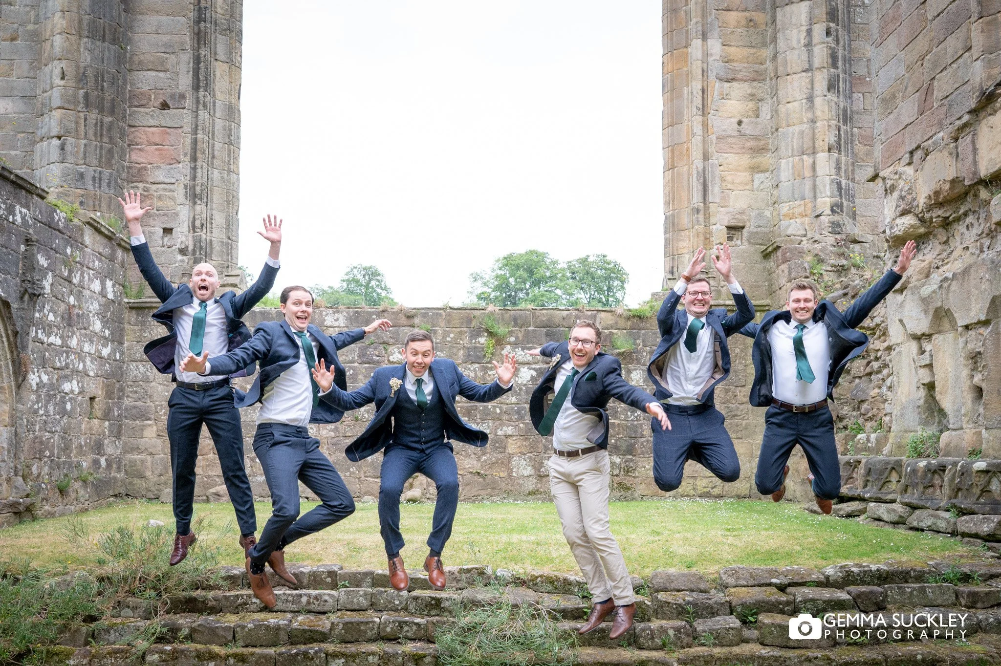 grooms party at bolton abbey priory ruins