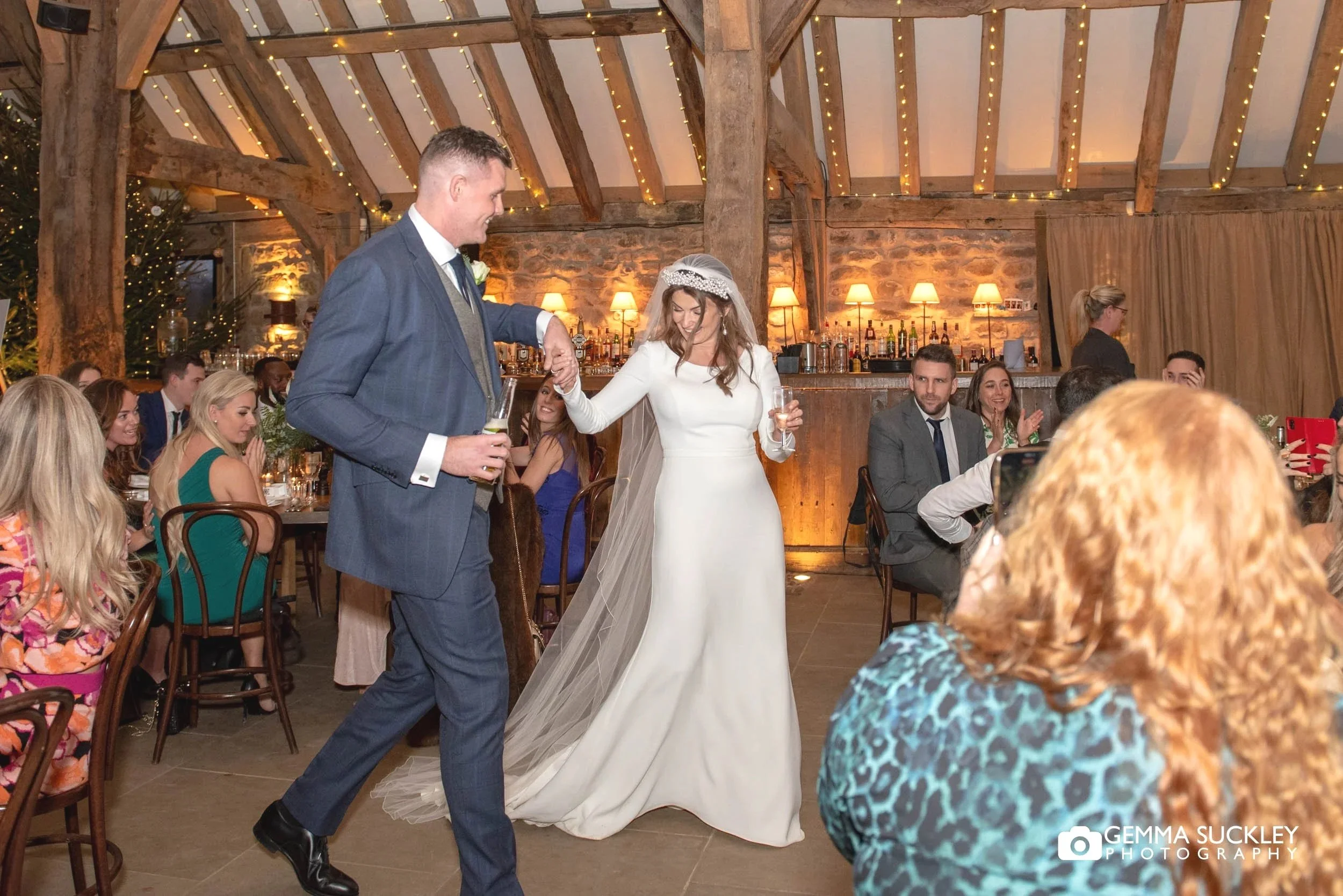 just married couple making their entrance at the tithe barn