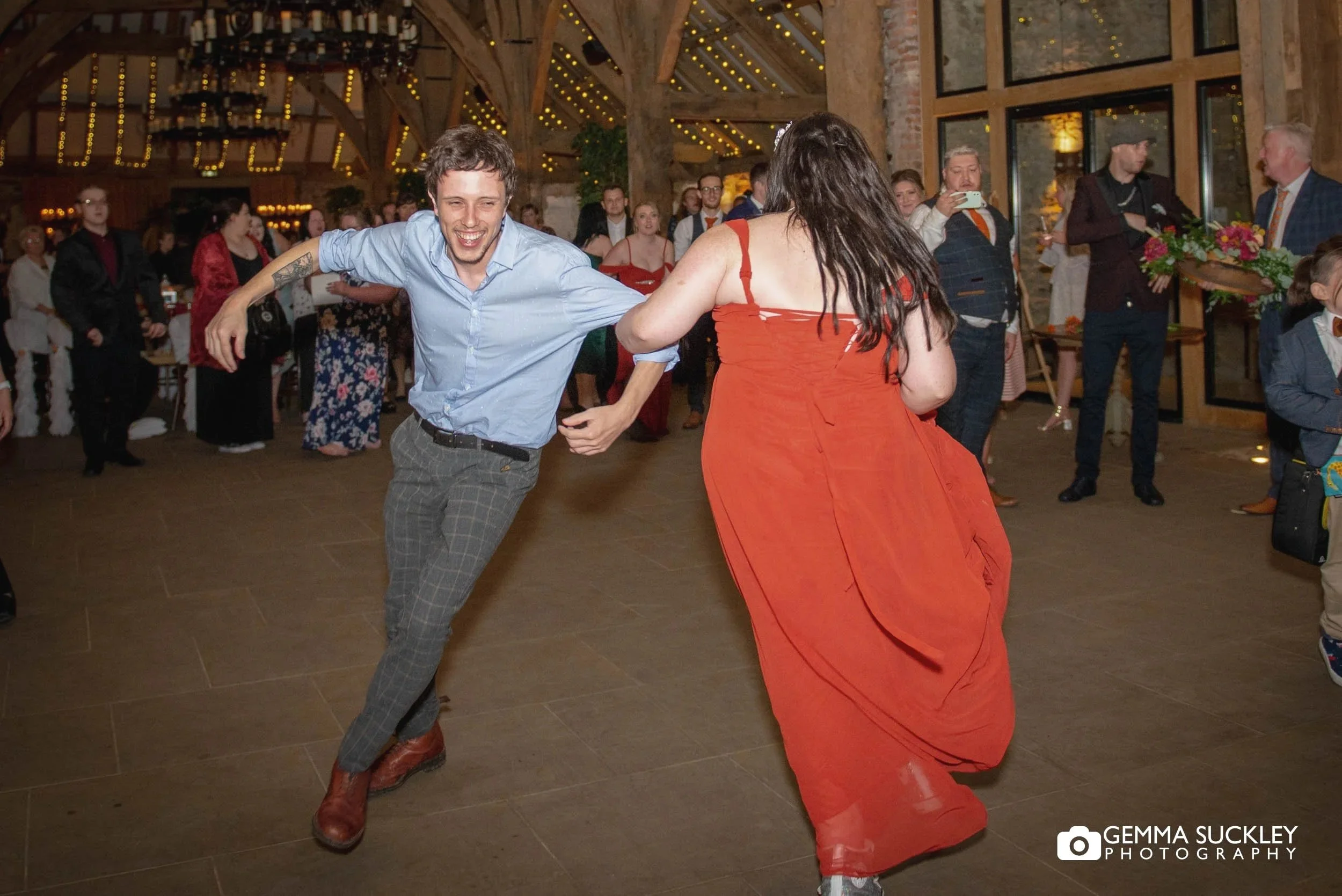 wedding guests dancing at the tithe barn