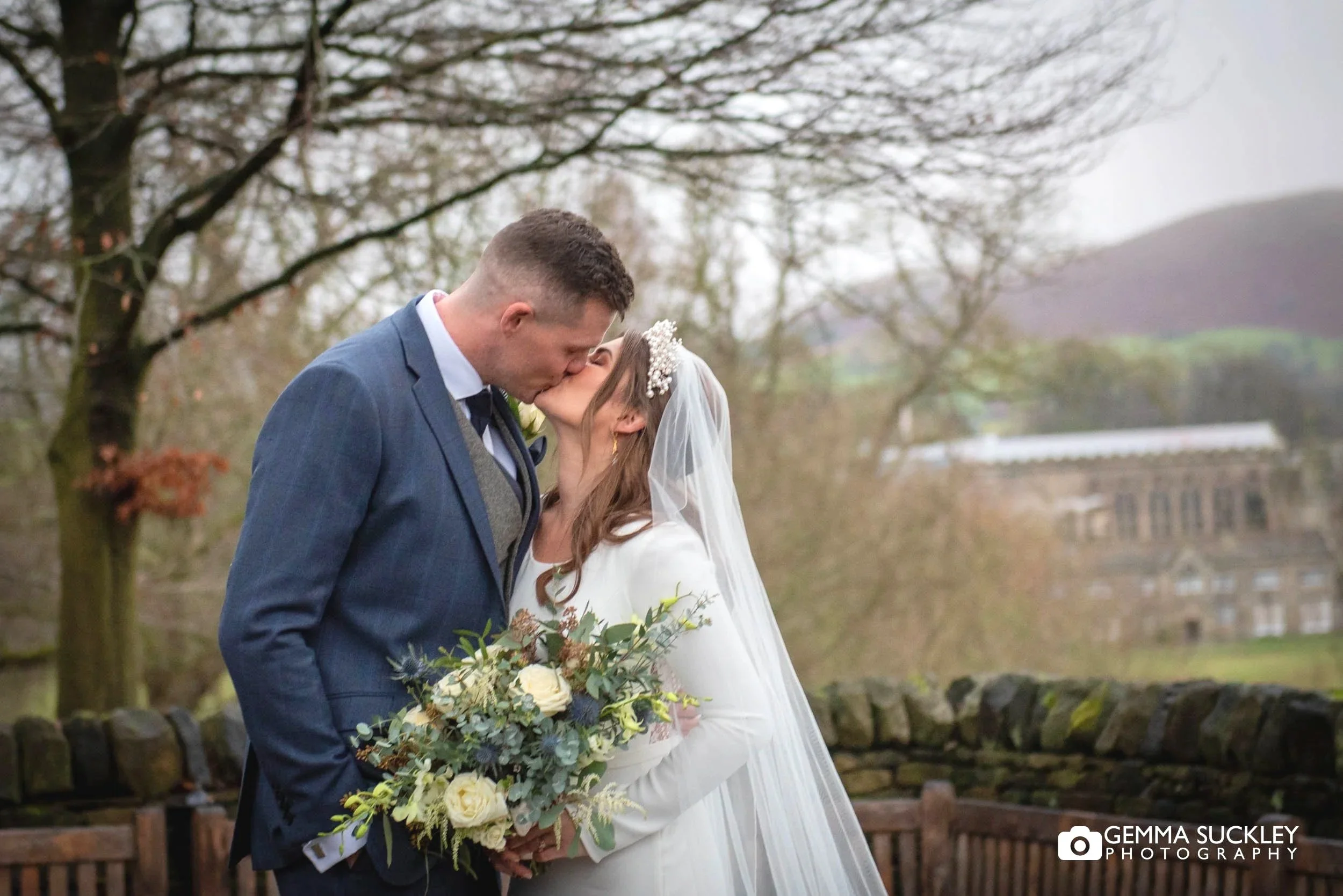 married couple outside the tithe barn in bolton abbey 