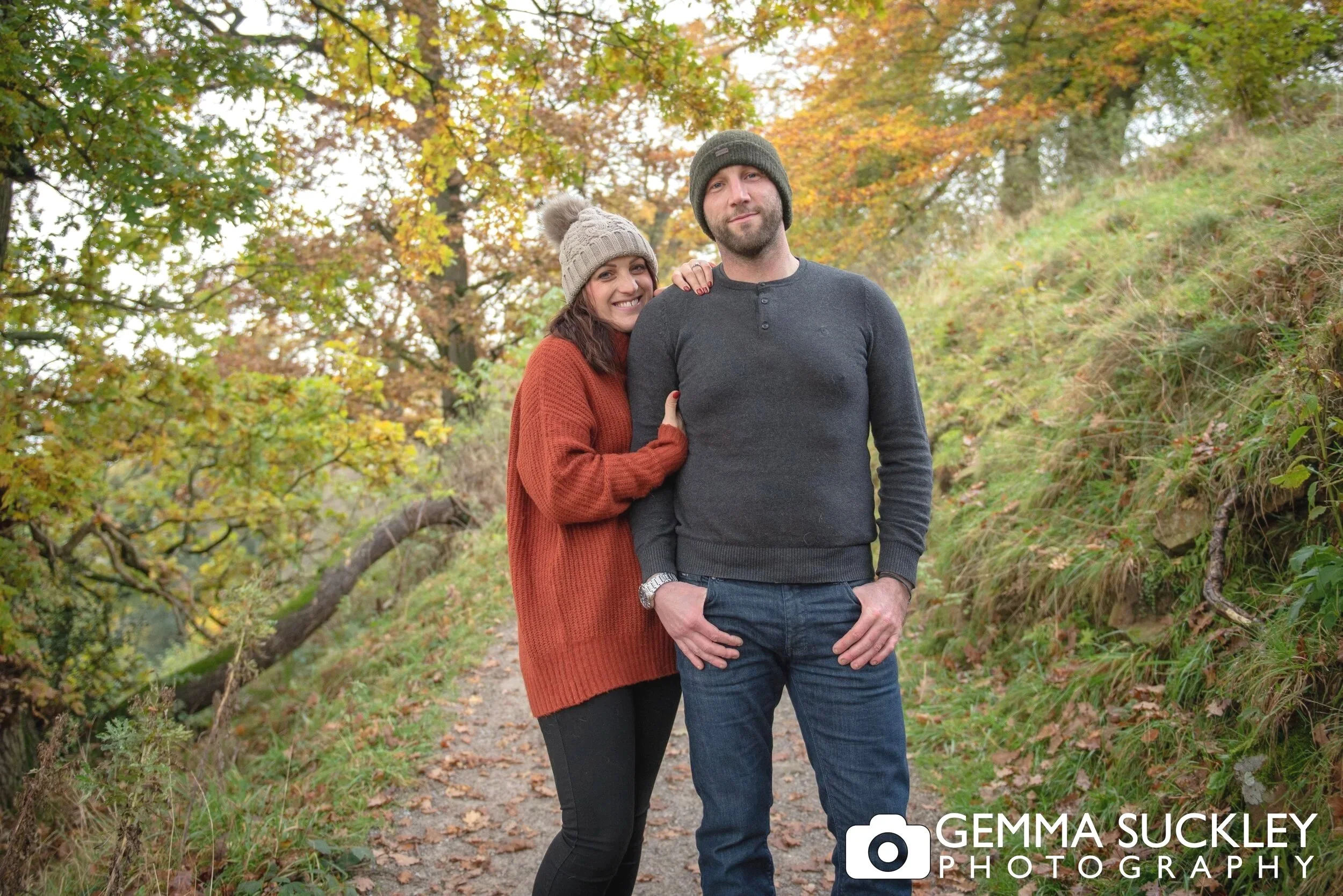 a smiling couple on their engagement photo shoot at bolton abbey 