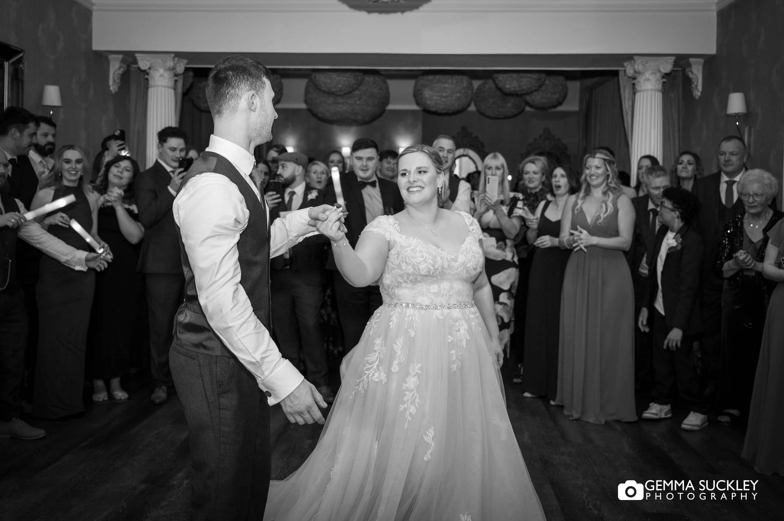 bride and groom walking on the dance floor at the falcon manor