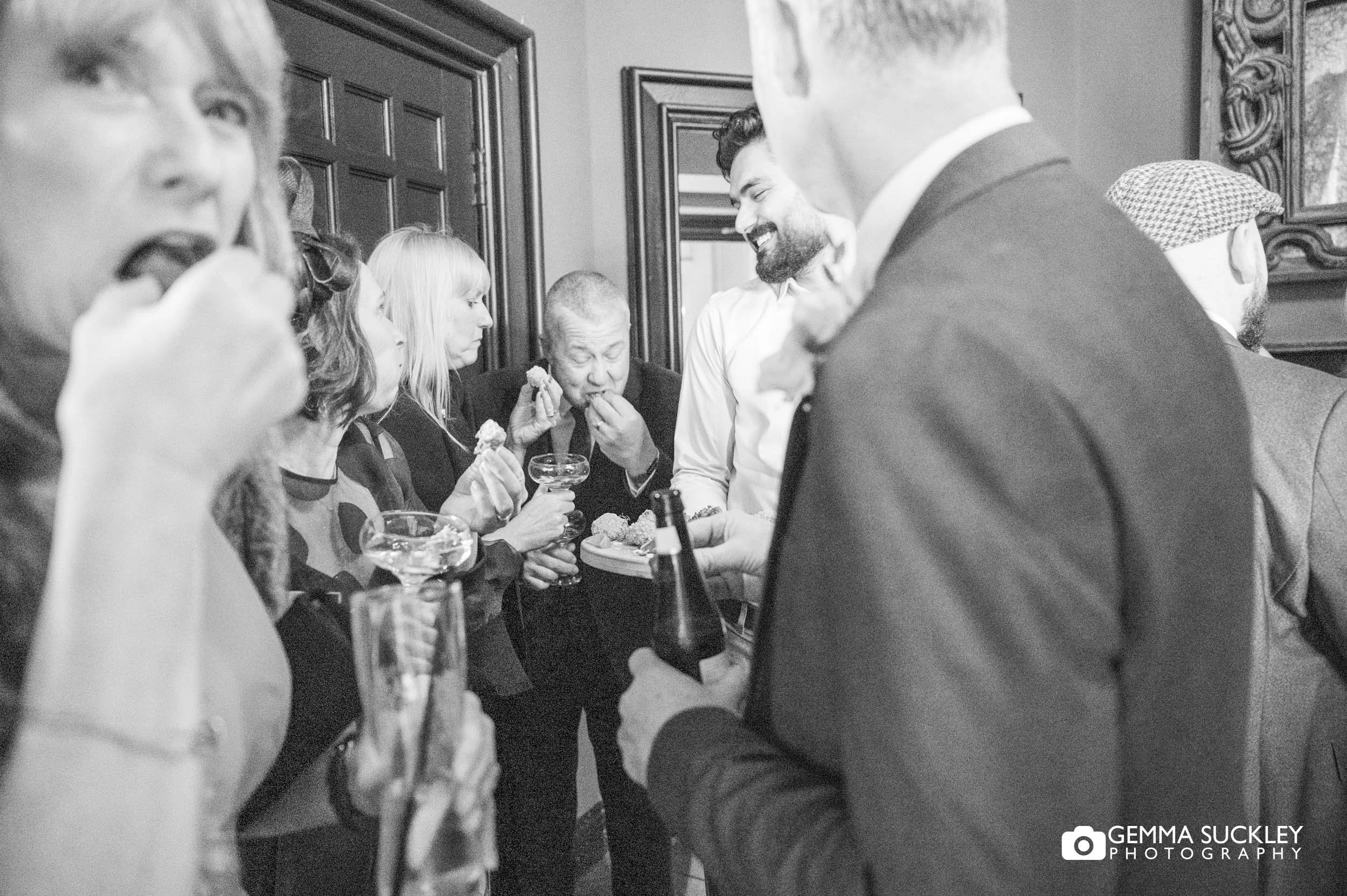 wedding guests eating canapés at the falcon manor