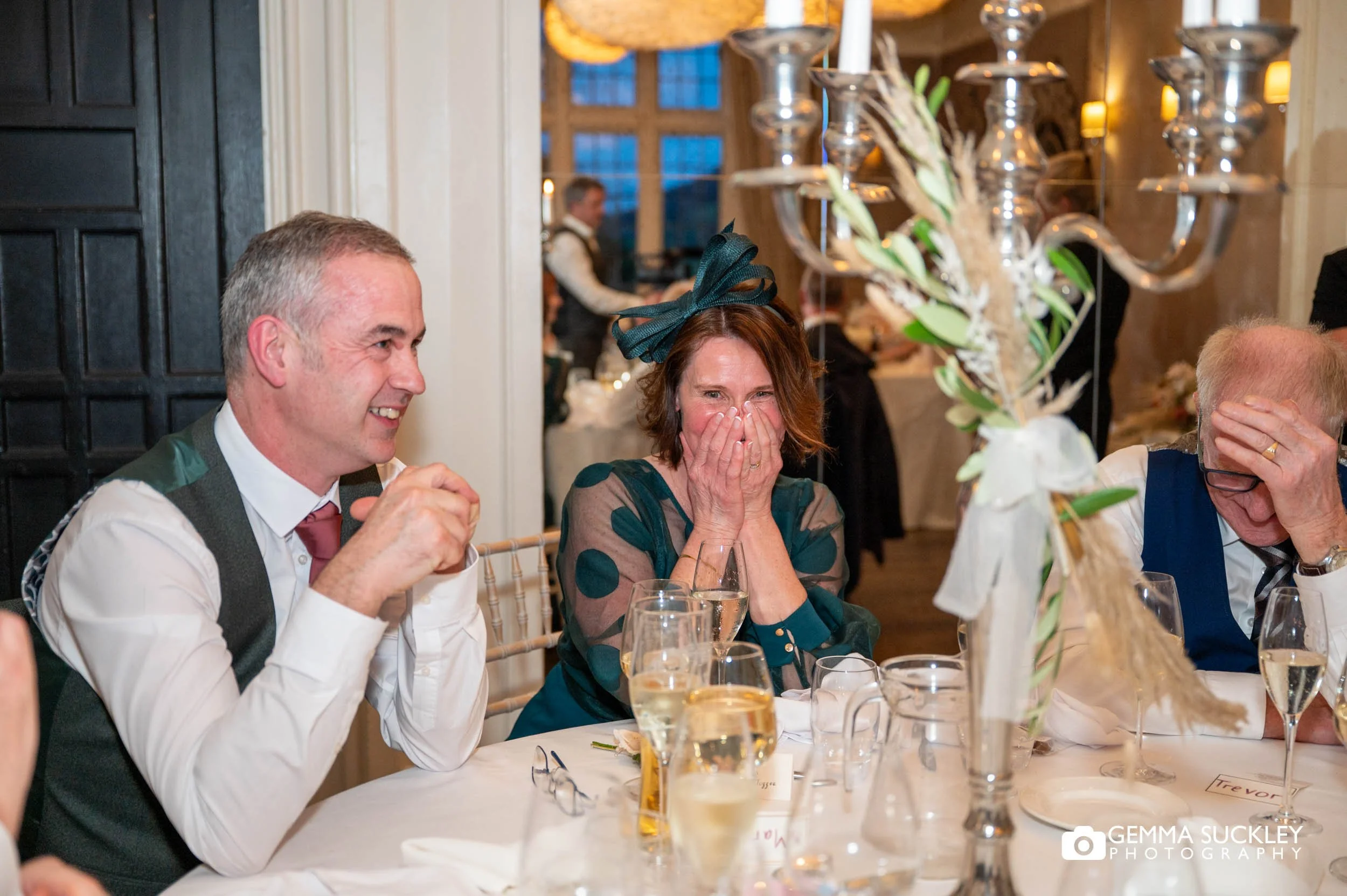 Wedding guest reacting to speeches during Falcon Manor reception in Settle