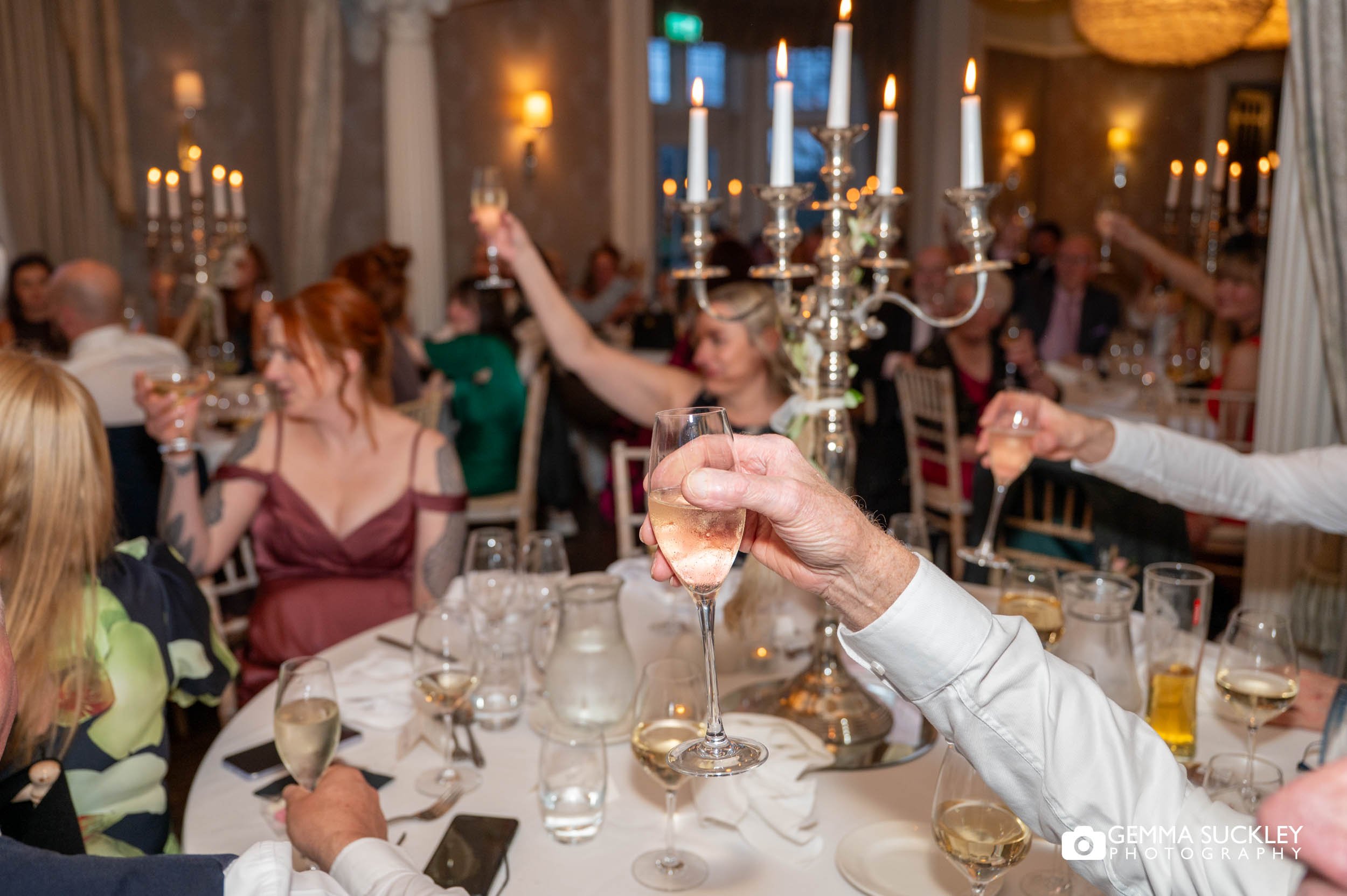 uests celebrating during winter wedding reception at Falcon Manor