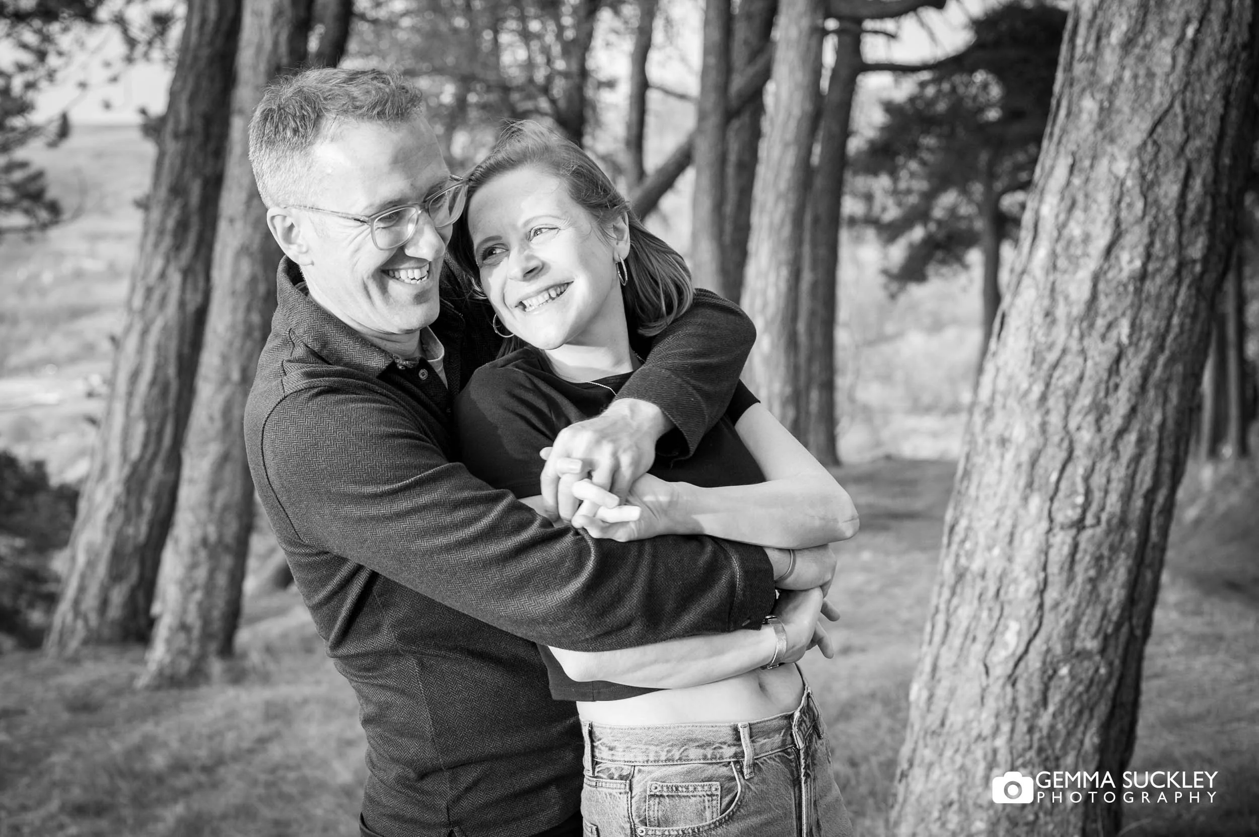 couple hugging together during their Ilkley Moor engagement shoot