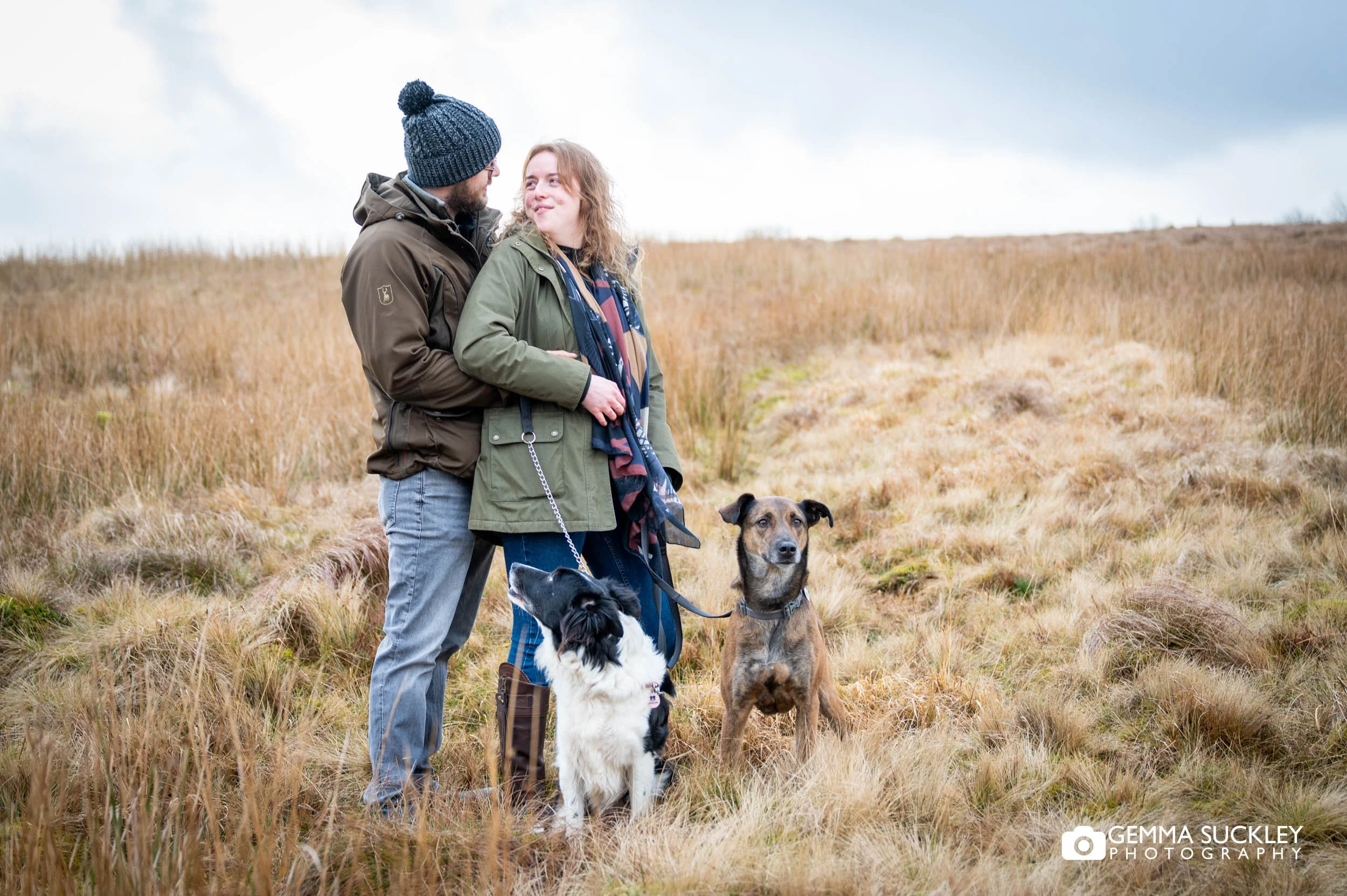 couple and their two dogs near ribblehead viaduct yorkshire dales