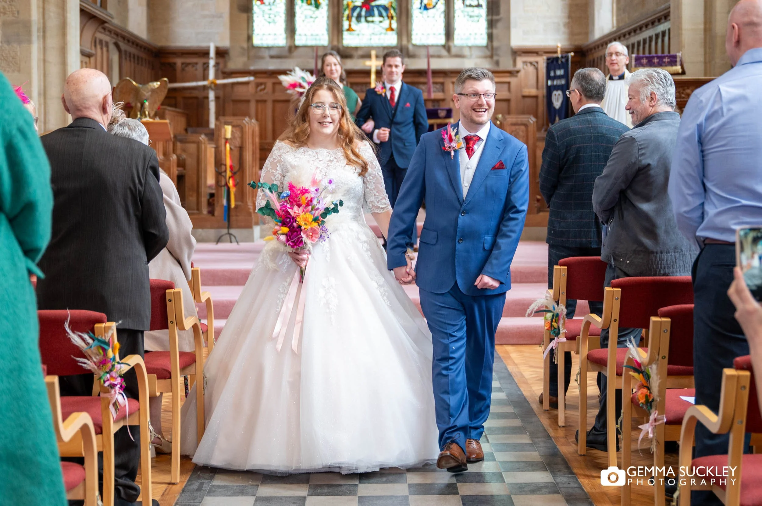 just married couple exiting the church in ilkley
