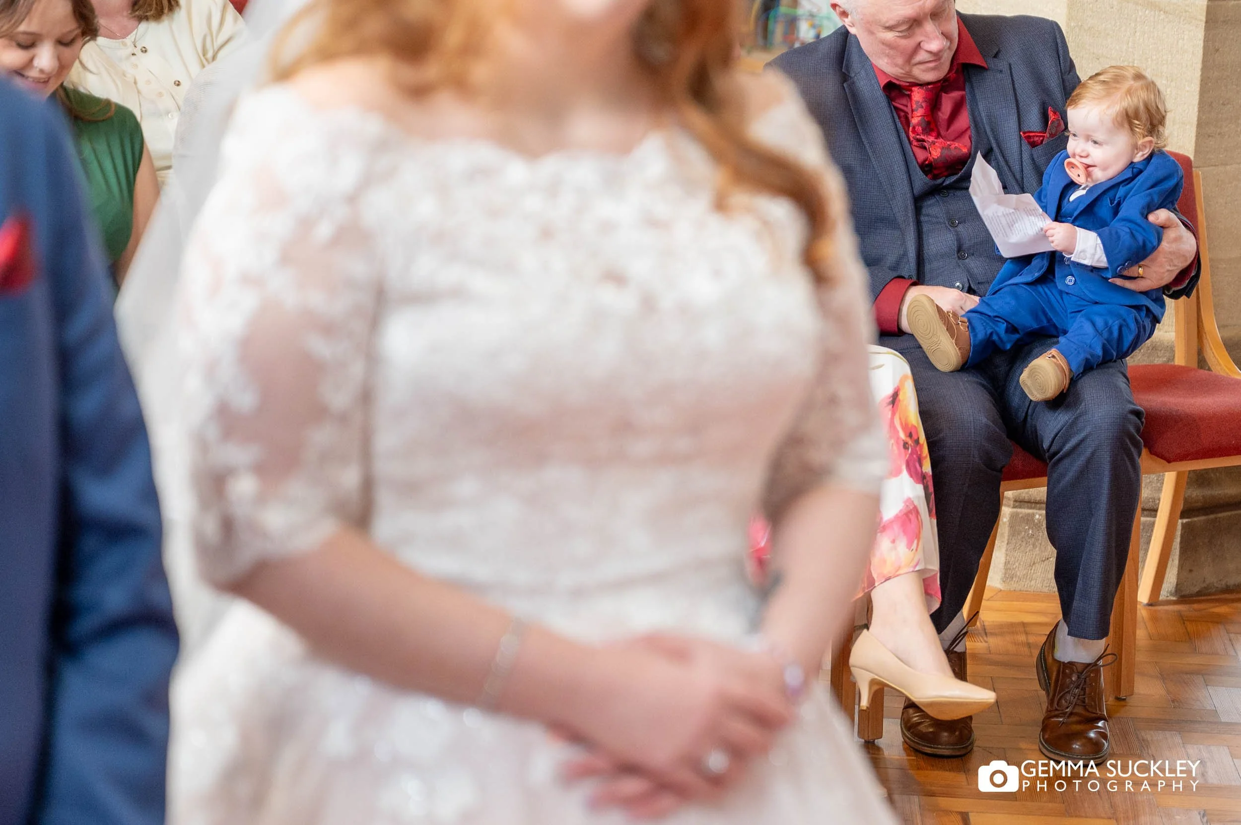 close on the the couples baby during the wedding ceremony