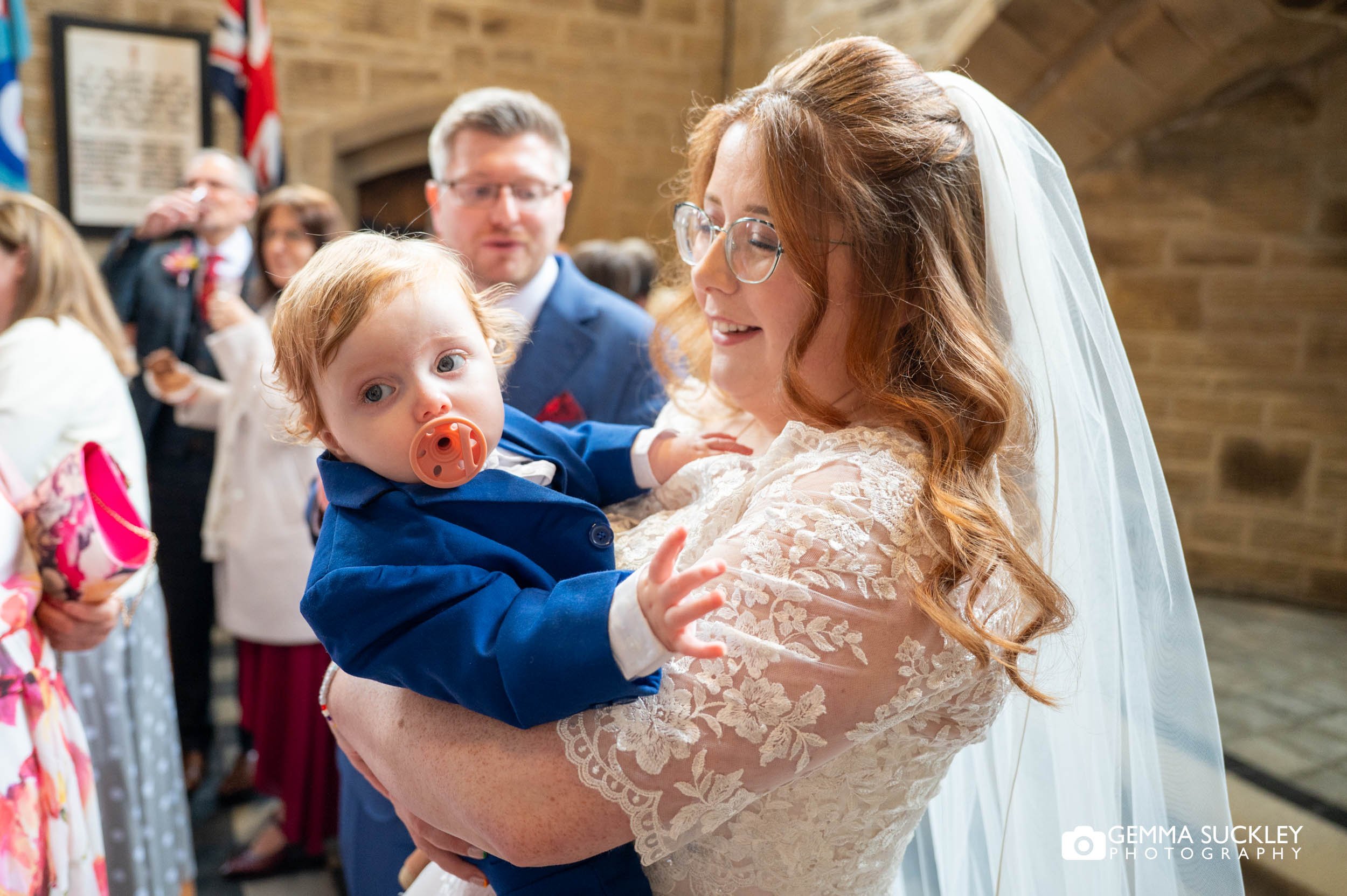 the bride with her baby after the wedding ceremony in ilkley