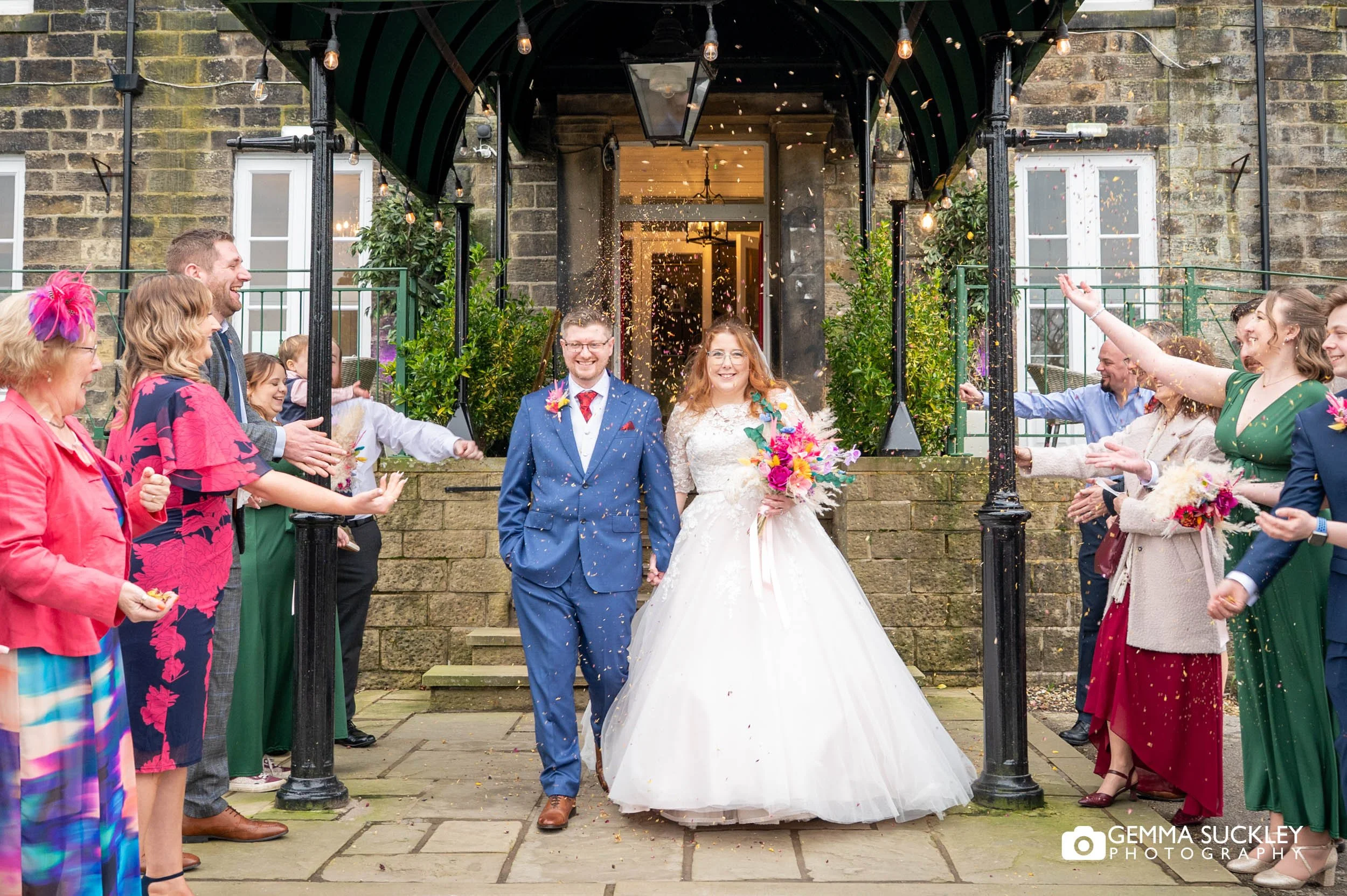 wedding guest throwing confetti at craiglands hotel in ilkley