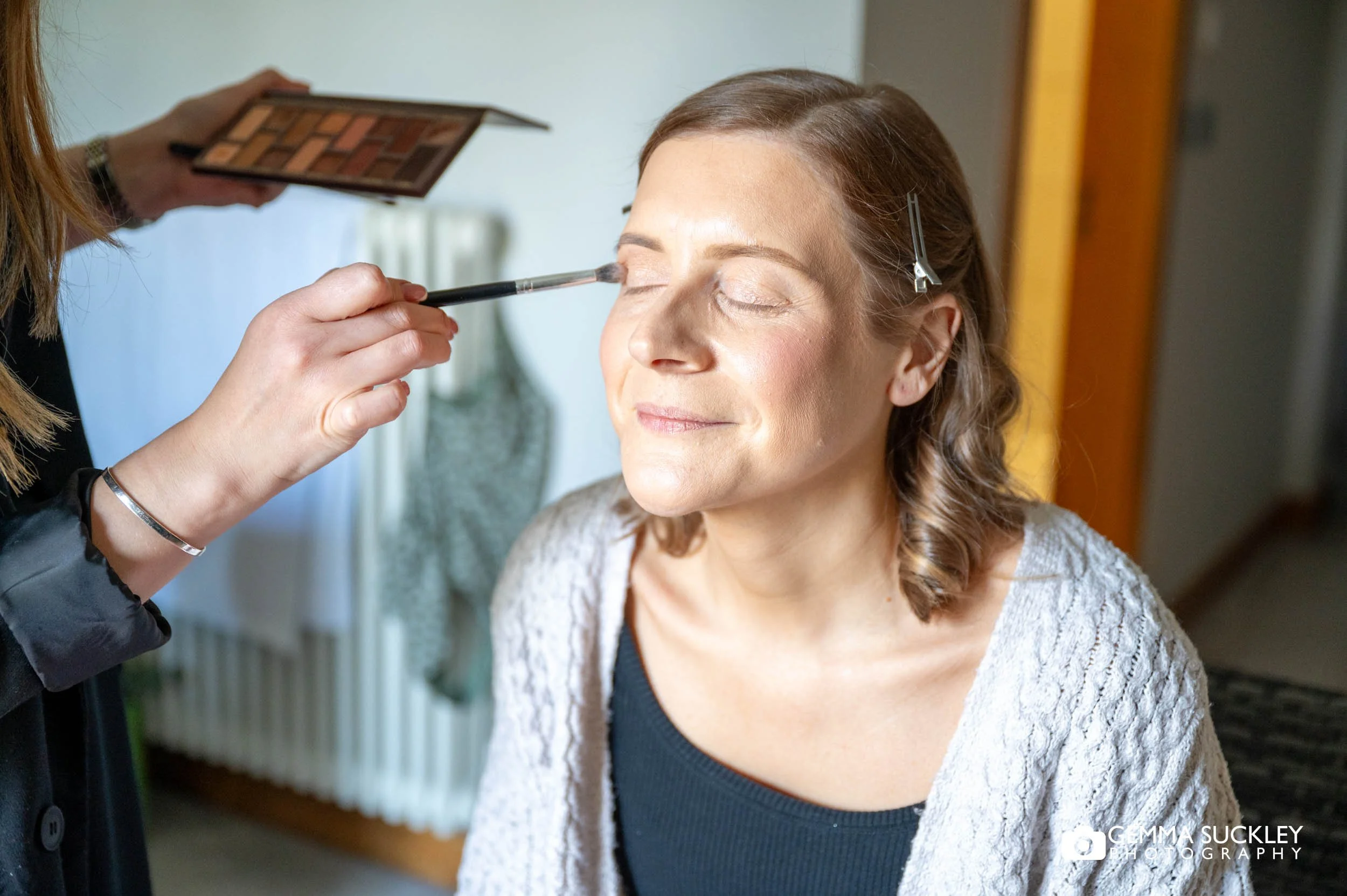 Bride having makeup done at The Gamekeeper’s Inn in the Yorkshire Dales