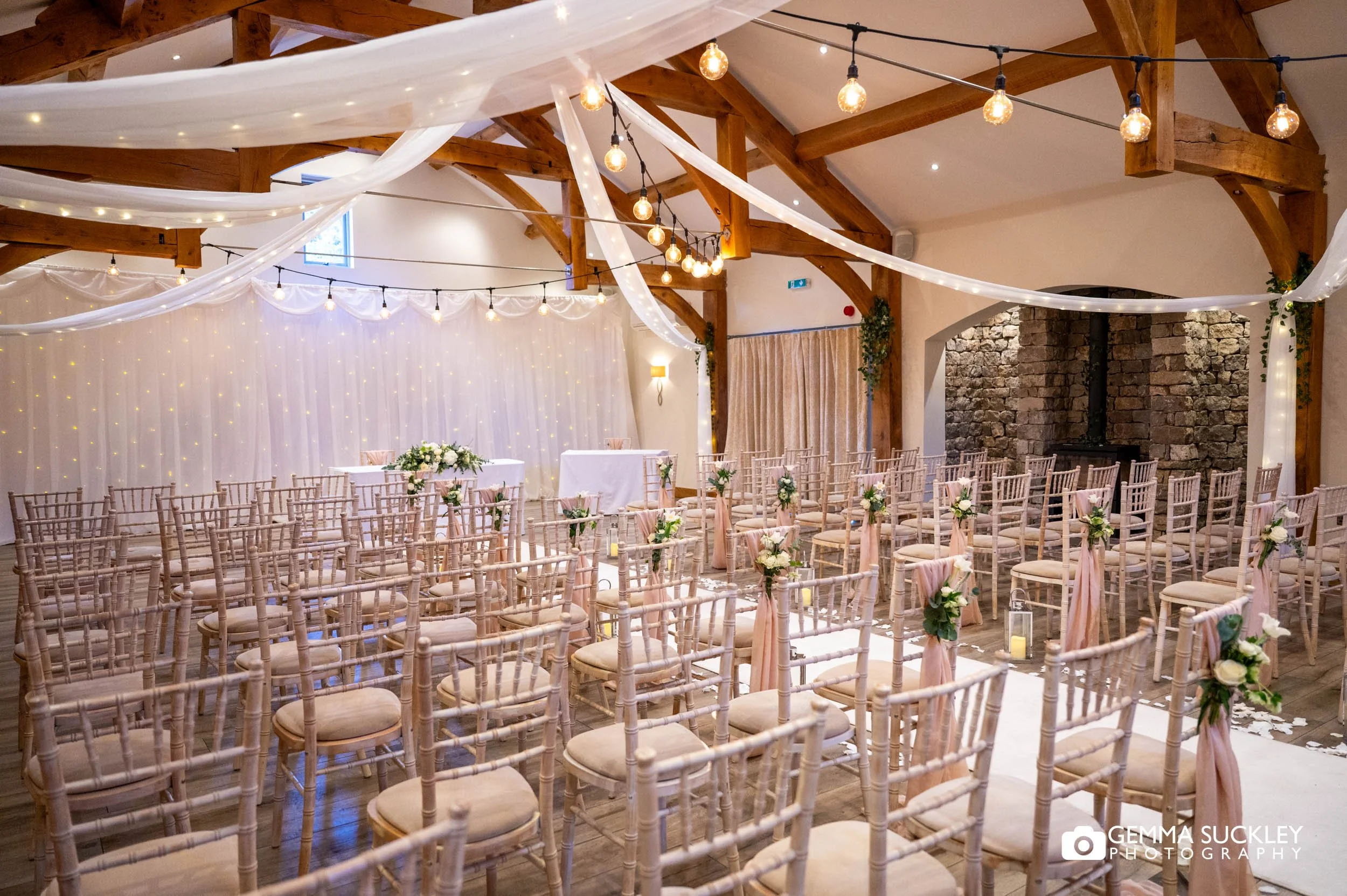 Rustic wedding ceremony with fairy lights at The Gamekeeper’s Inn