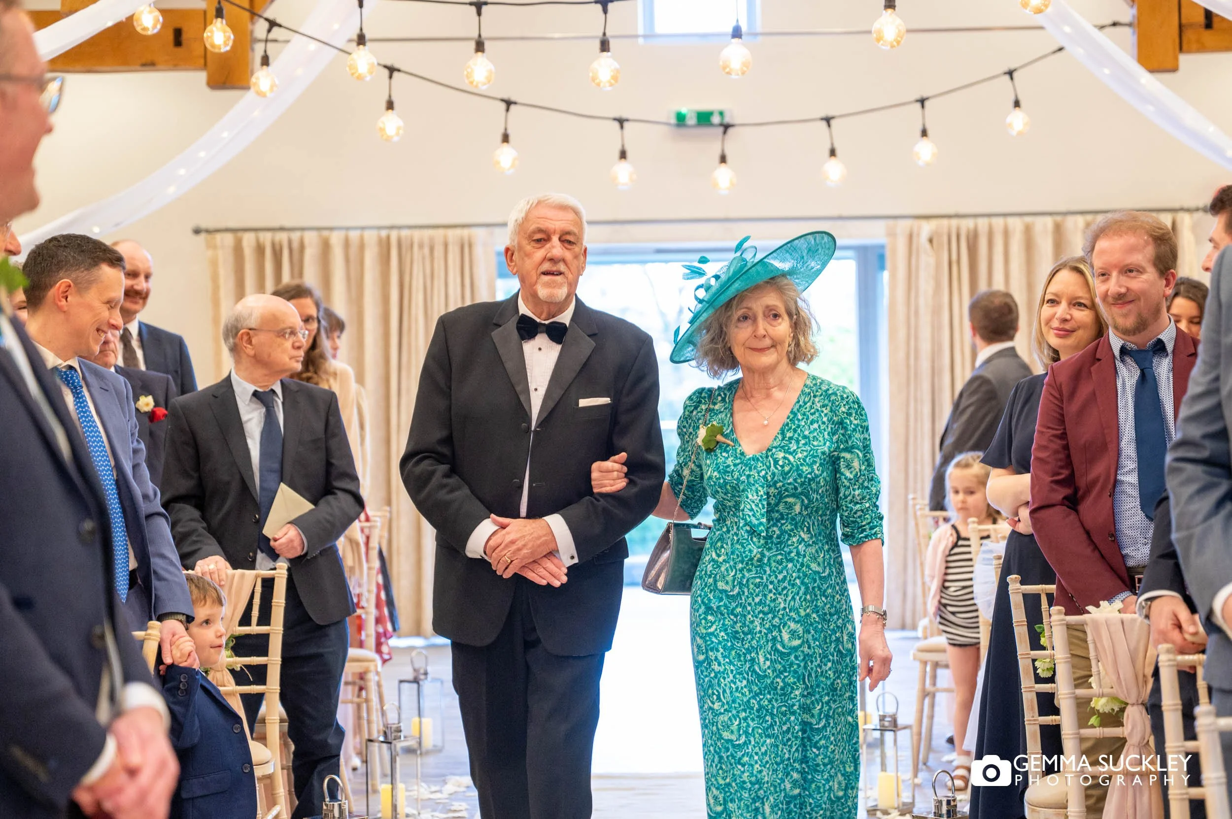 brides mother walking down the aisle at the gameskeepers inn 