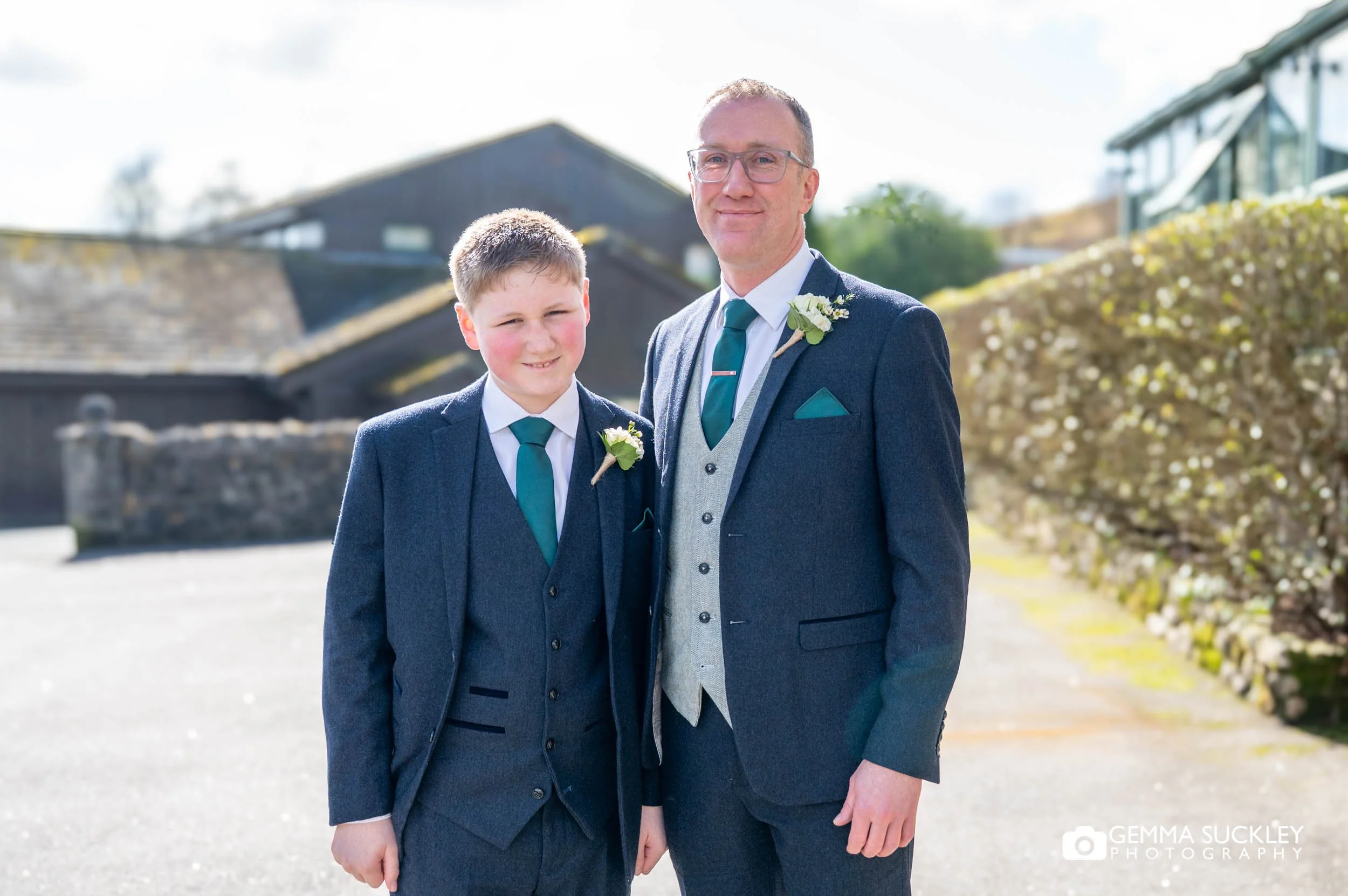 groom and best man outside the gamekeeper's inn