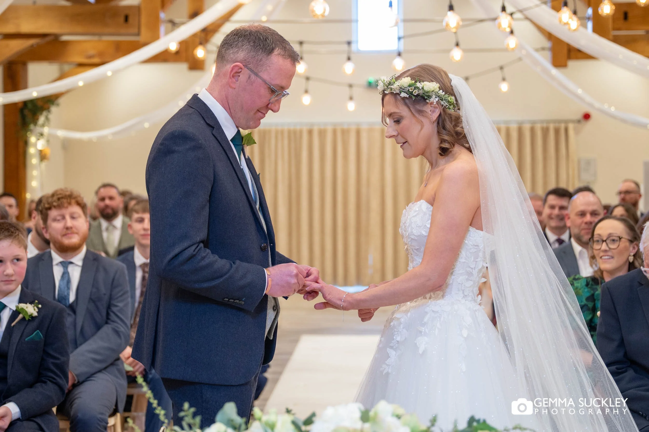 couple exchanging rings at the gamekeeper's inn wedding ceremony