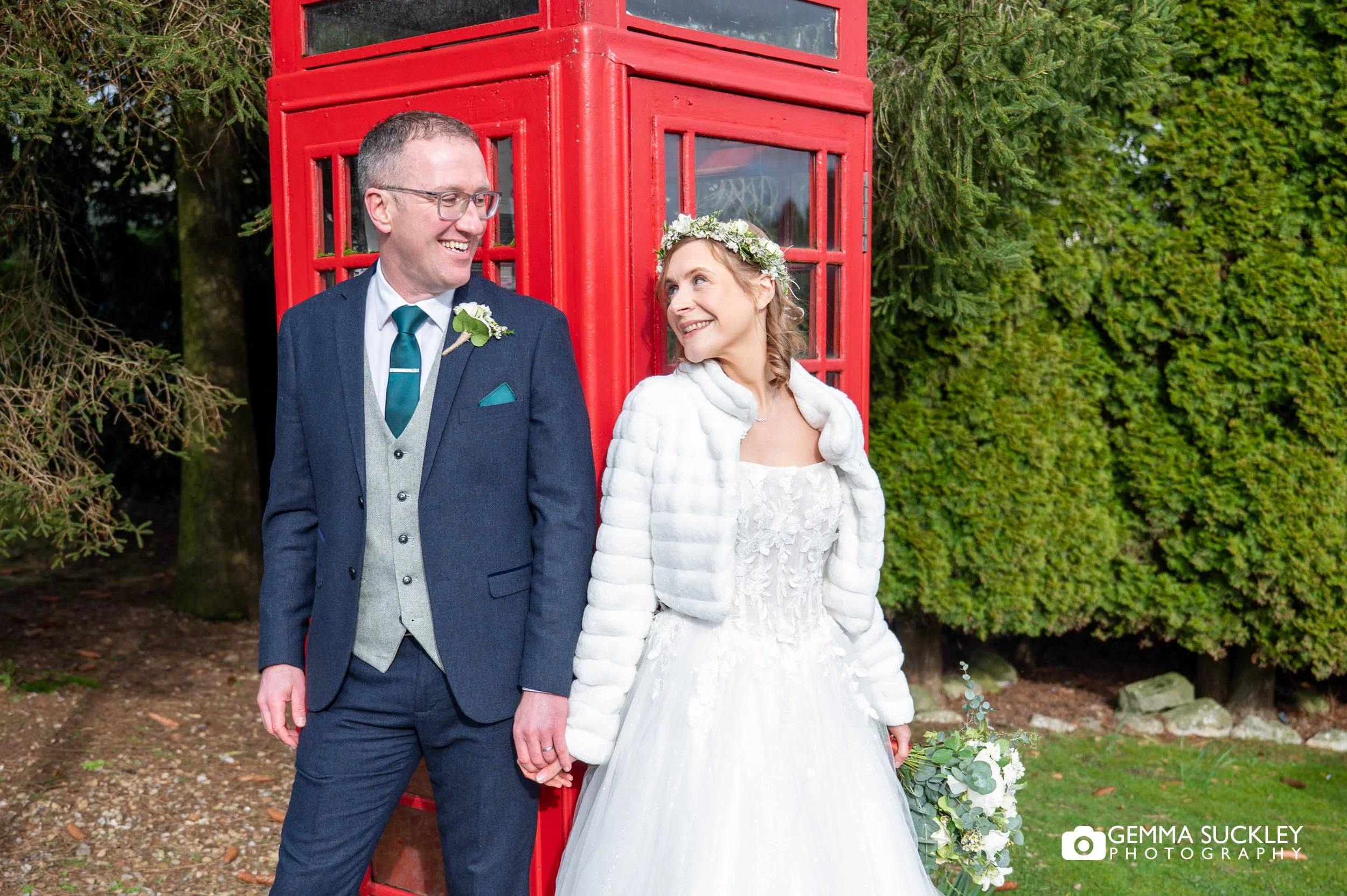 couple portraits by the phonebox at The Gamekeeper’s Inn wedding
