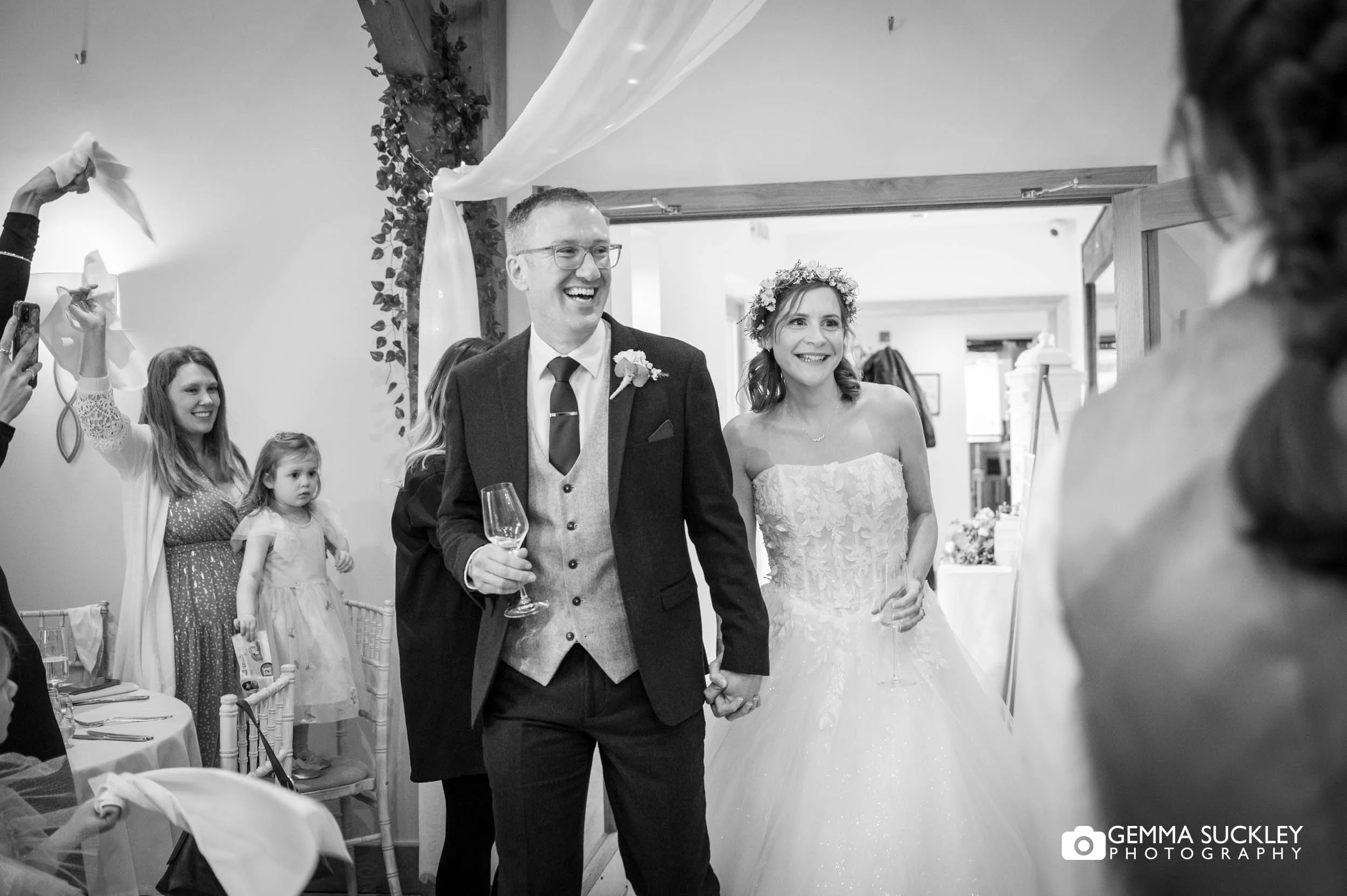 just married couple entering the wedding breakfast room