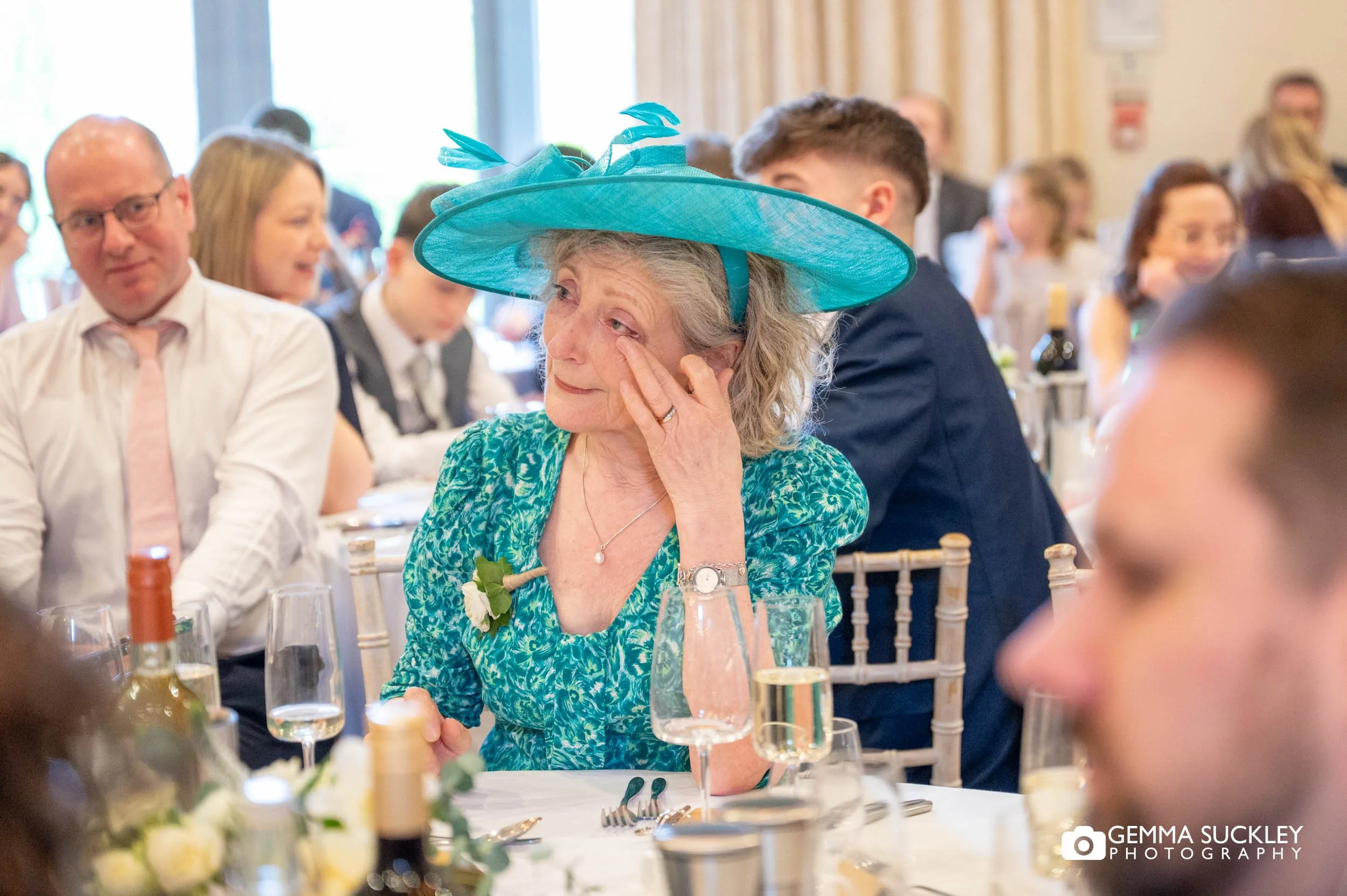 mother of the bride crying at speeches at the gamekeeper's inn wedding