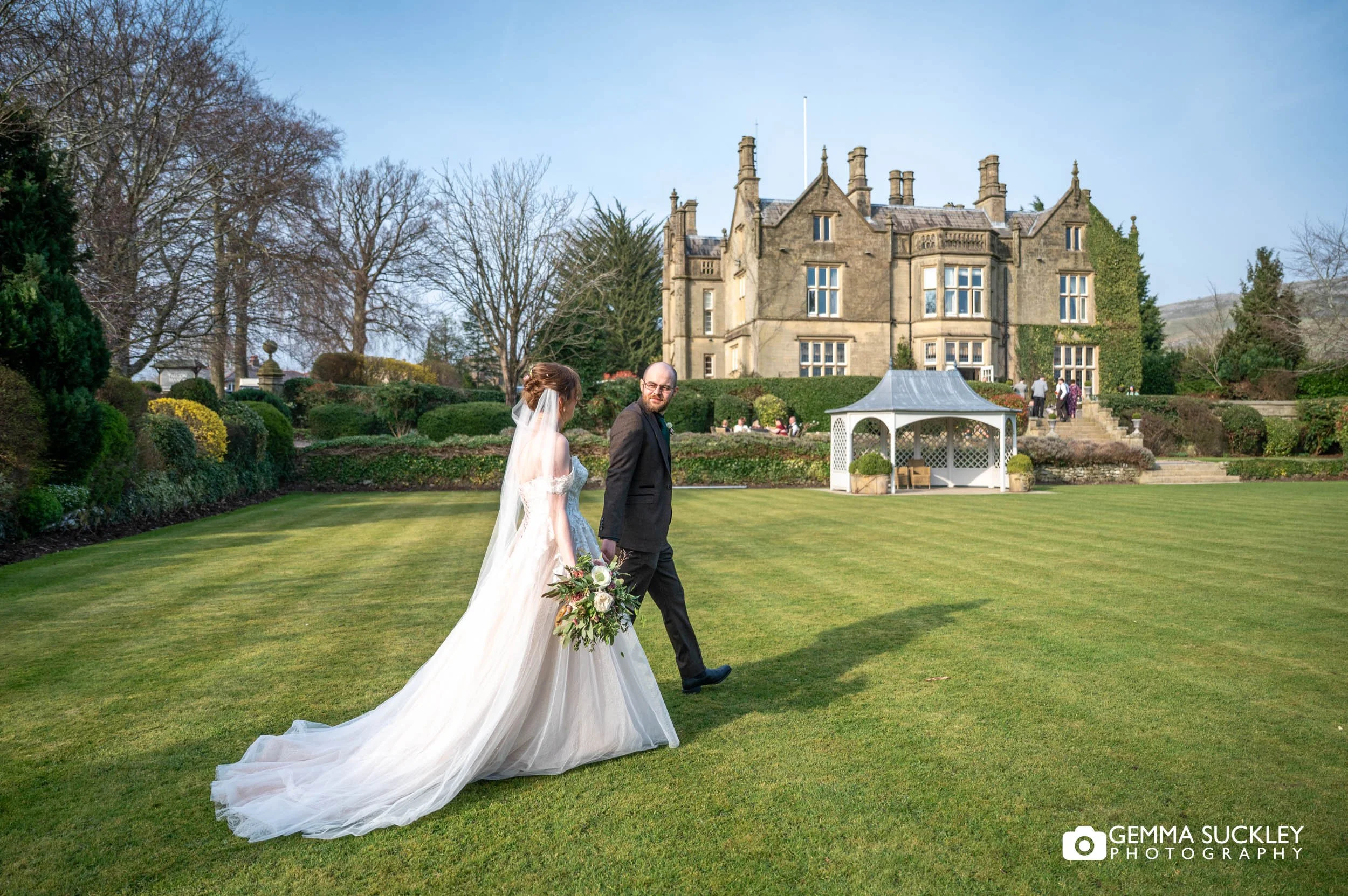 Married couple walking in the gardens at Falcon Manor in Settle