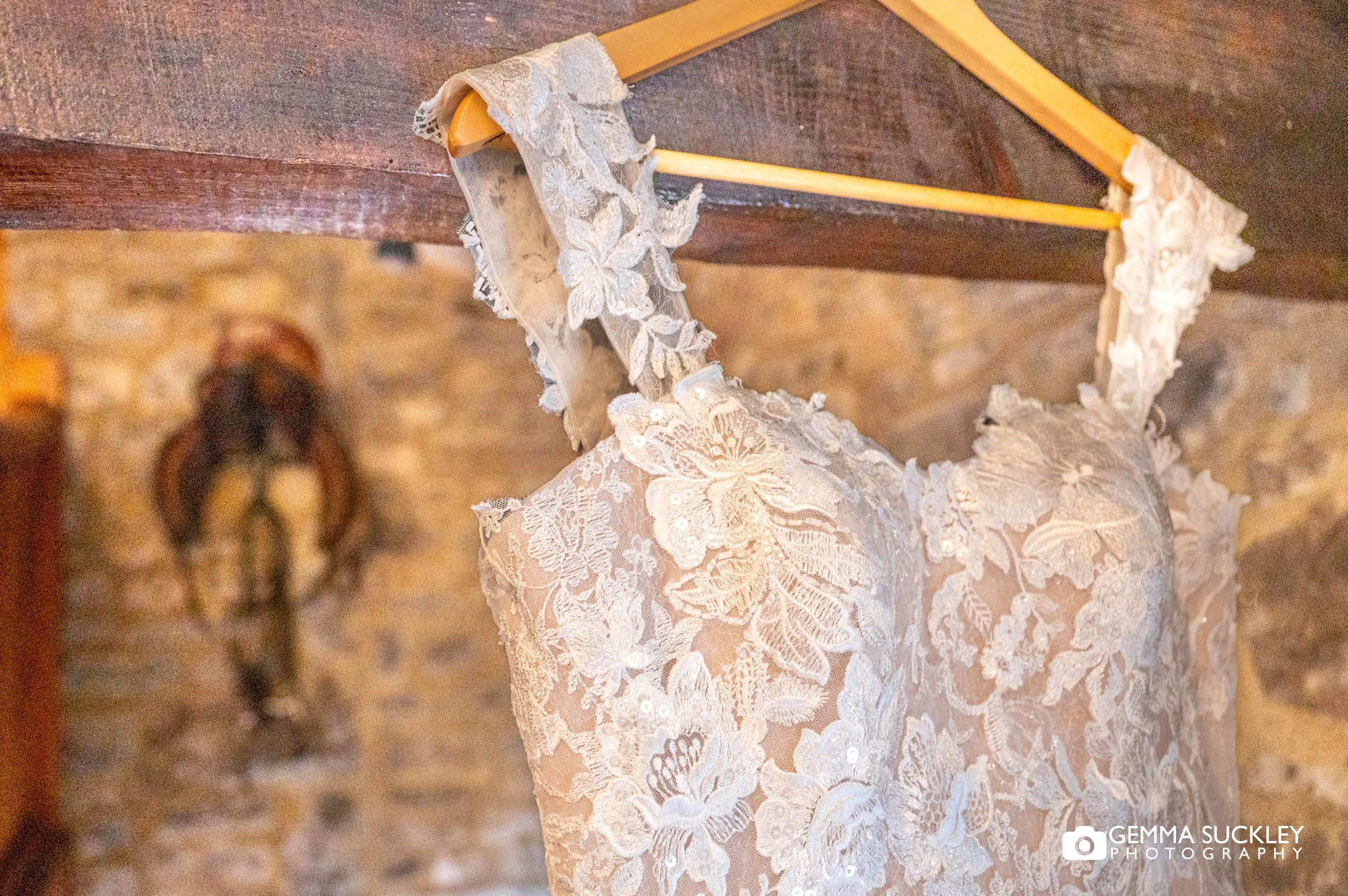 Wedding dress hanging in bridal prep room at Falcon Manor