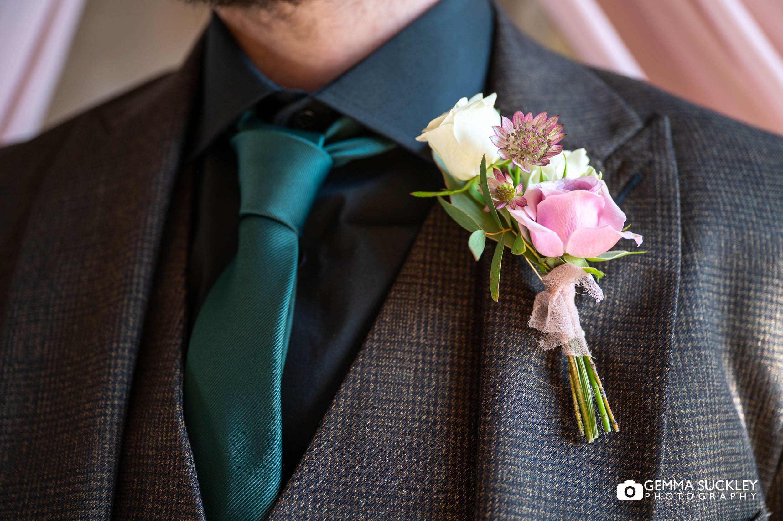 flower button hole detail at settle wedding