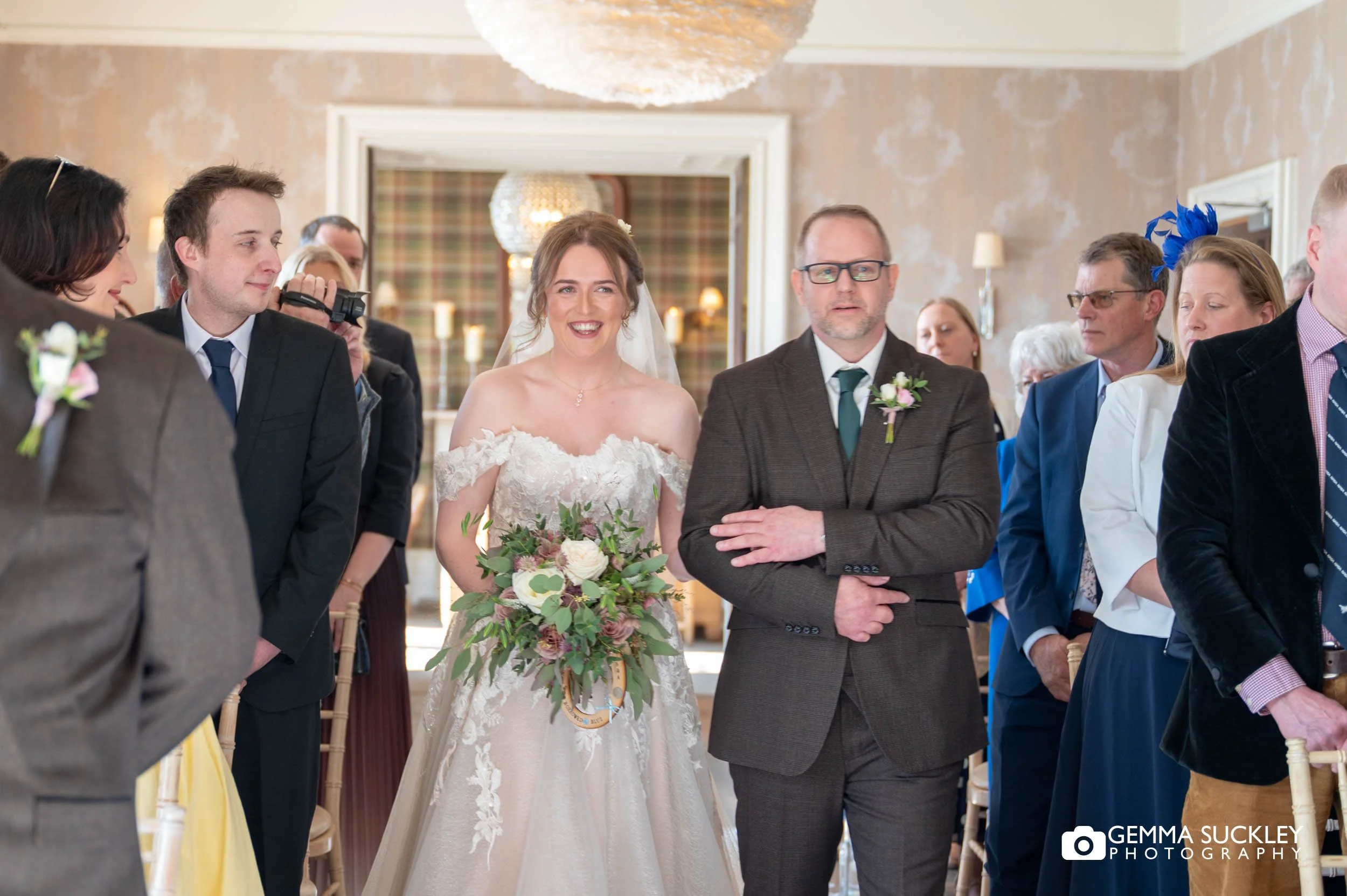 Bride walking down the aisle at Falcon Manor wedding ceremony