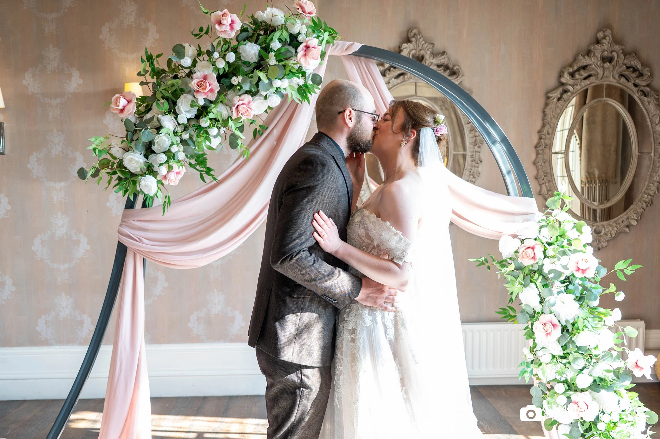 just married couple first kiss at the falcon manor wedding ceremony