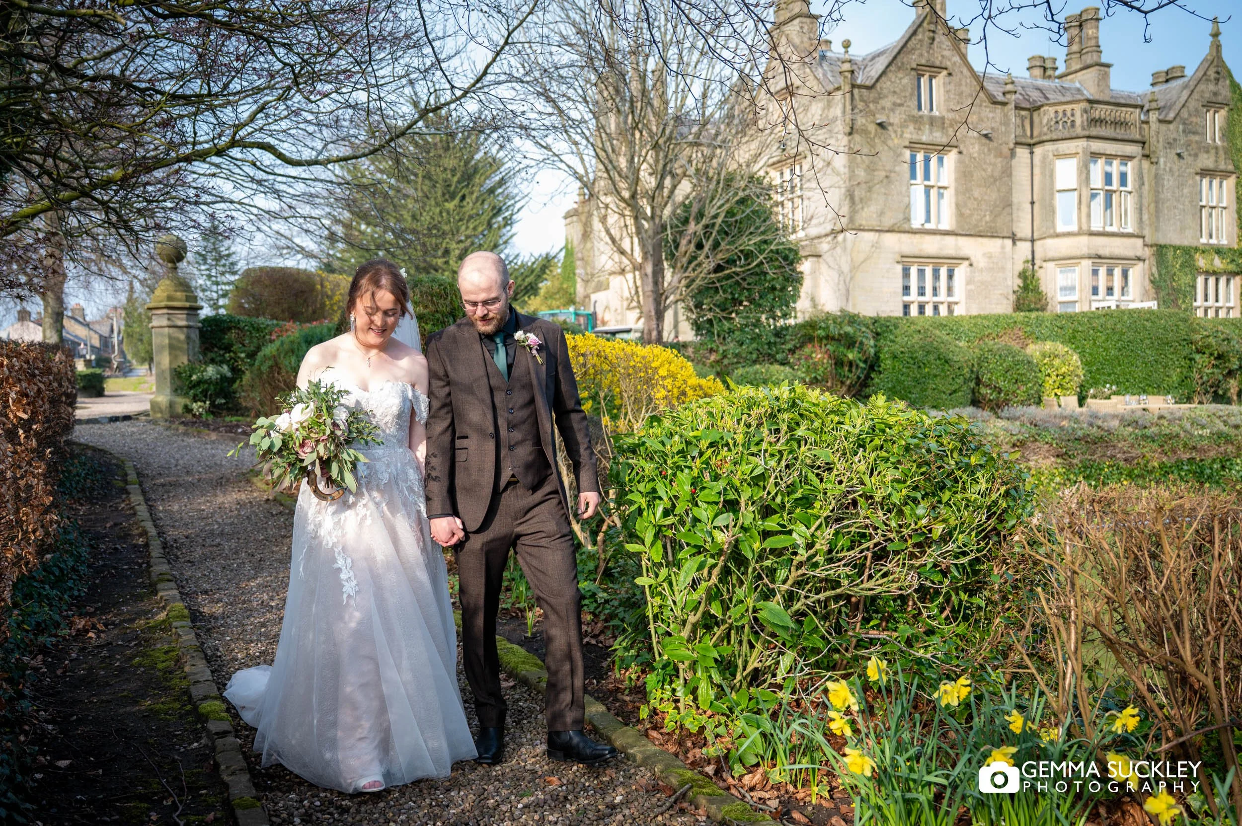 Relaxed couple portraits in the gardens at Falcon Manor Settle
