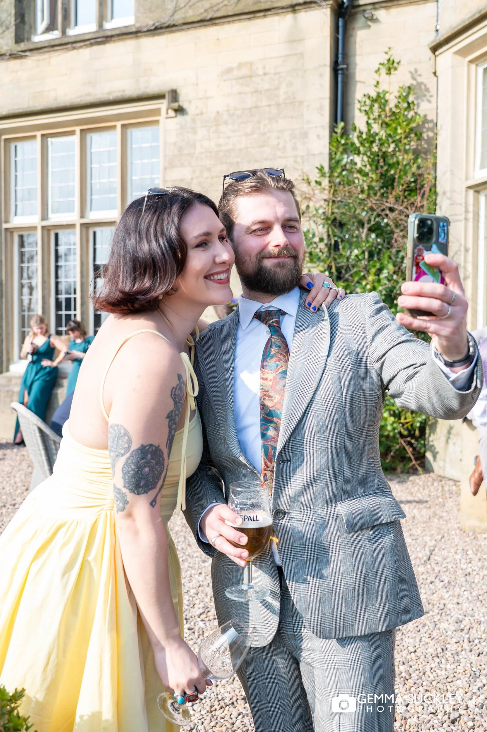 Guests laughing and mingling at Falcon Manor wedding reception