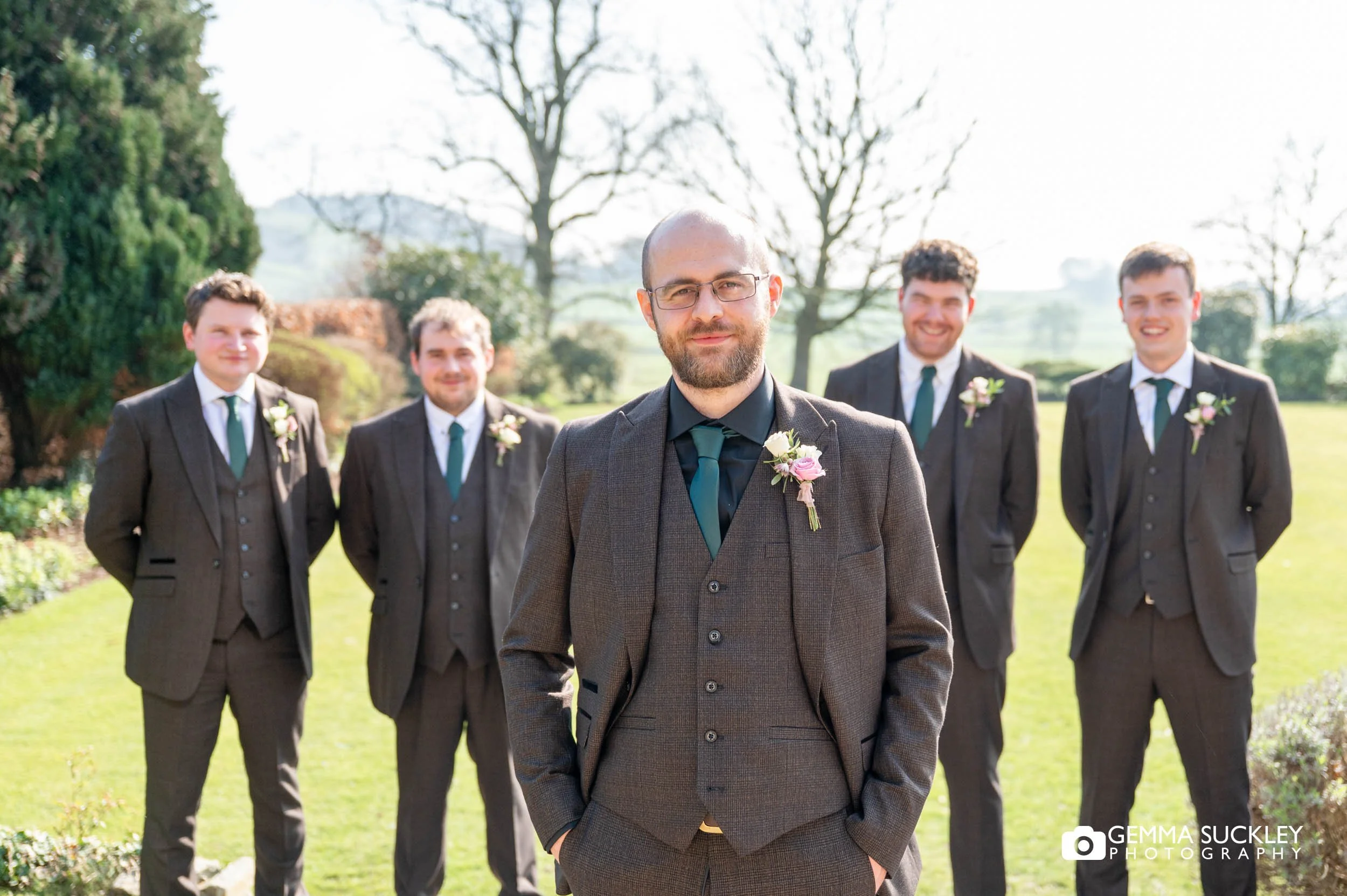 grooms party portraits on the lawn at the falcon manor