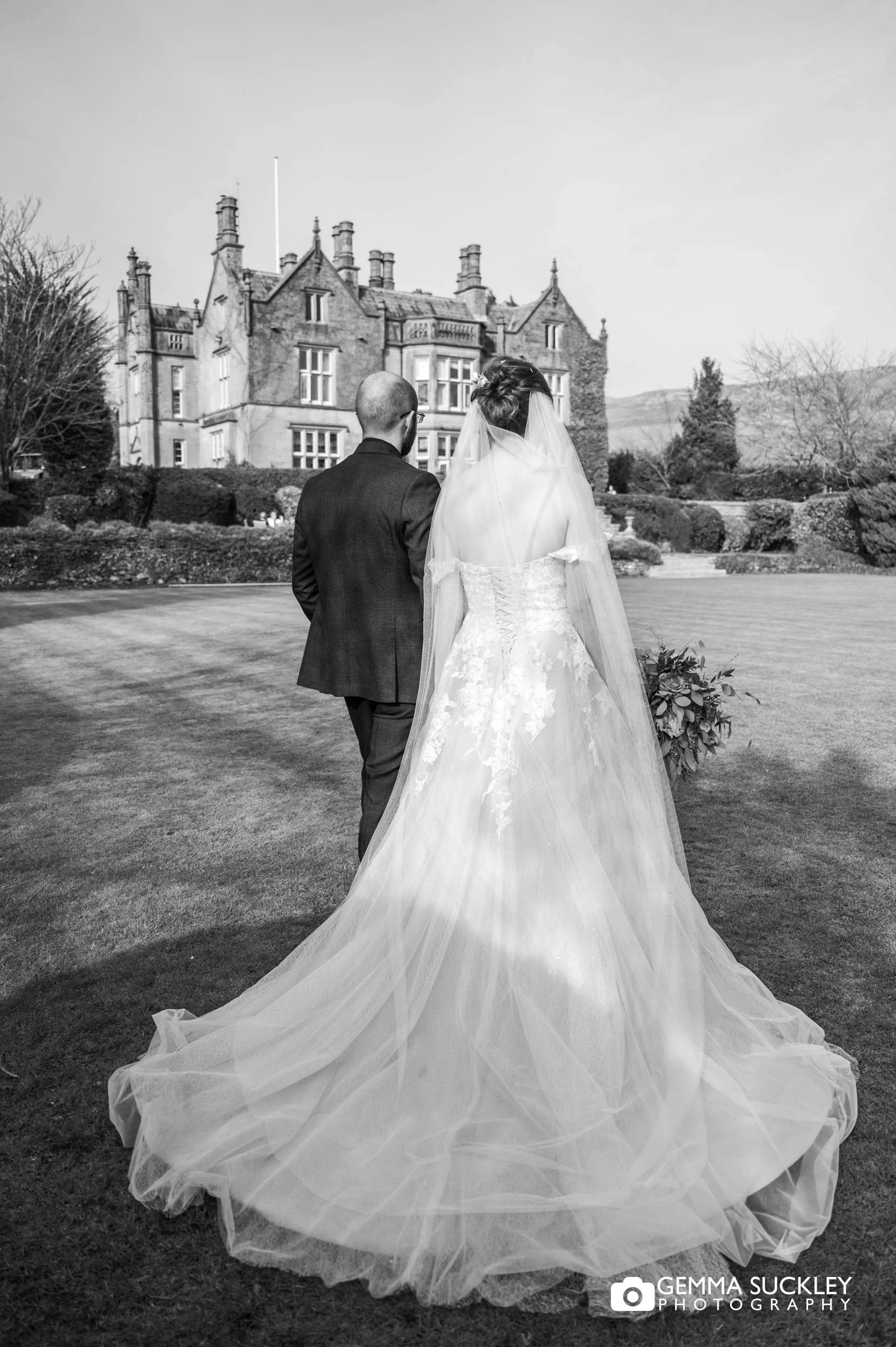 Bride and groom walking together in Falcon Manor grounds